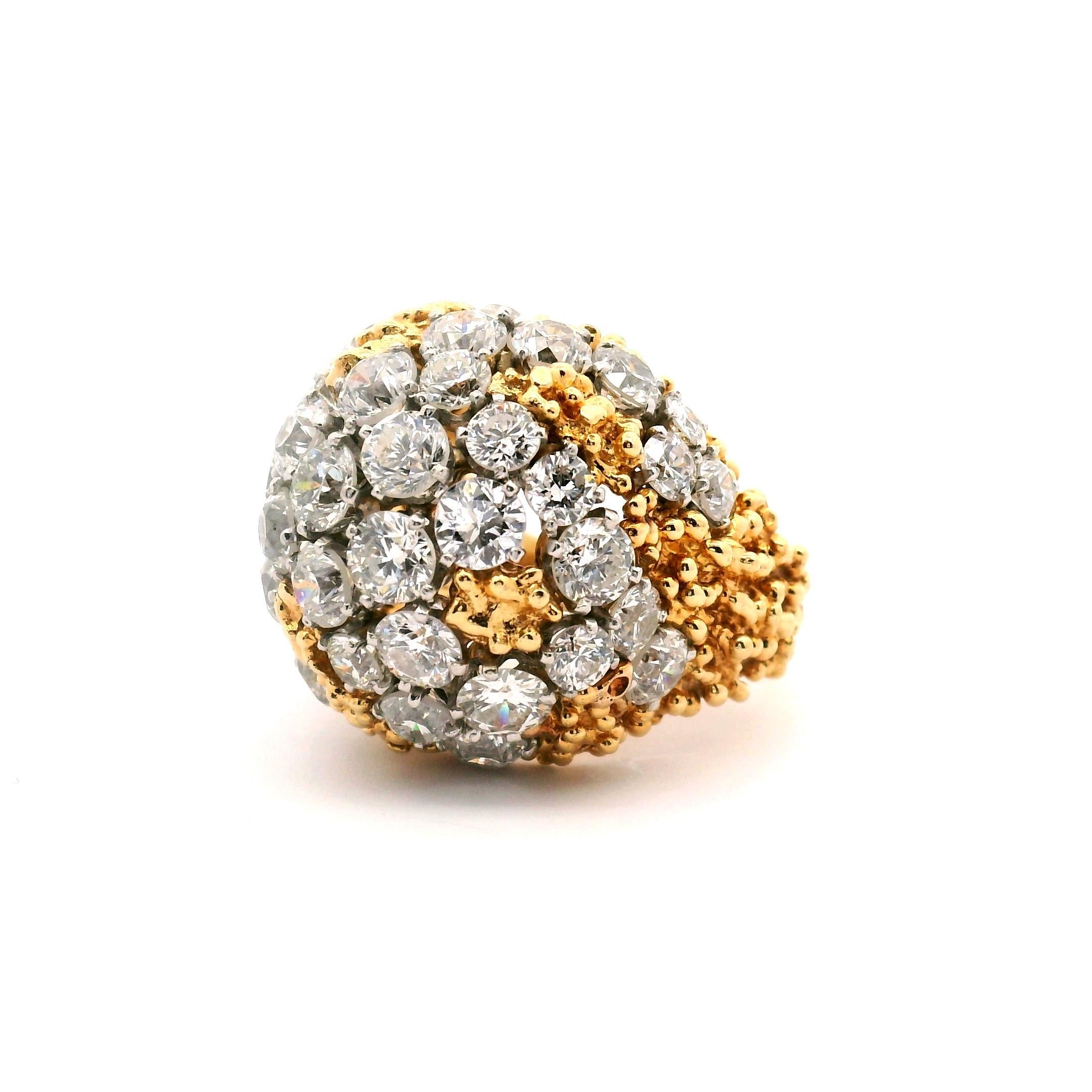 Designed by Ruser in the mid 20th Century is this stunning diamond dome ring.

45 round brilliant cut diamonds 

4-.10ct. 
11-.15ct.
12-.25ct.
3-.28ct.
15-.35ct.
With a total weight of approximately 11.14cttw.

18k yellow gold 
Diamond are set in