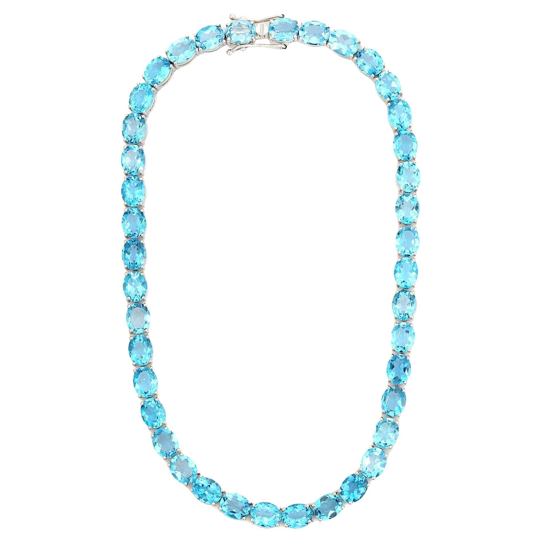 111.46 Carat Faceted Oval Cut Blue Topaz Tennis Necklace in 925 Sterling Silver For Sale
