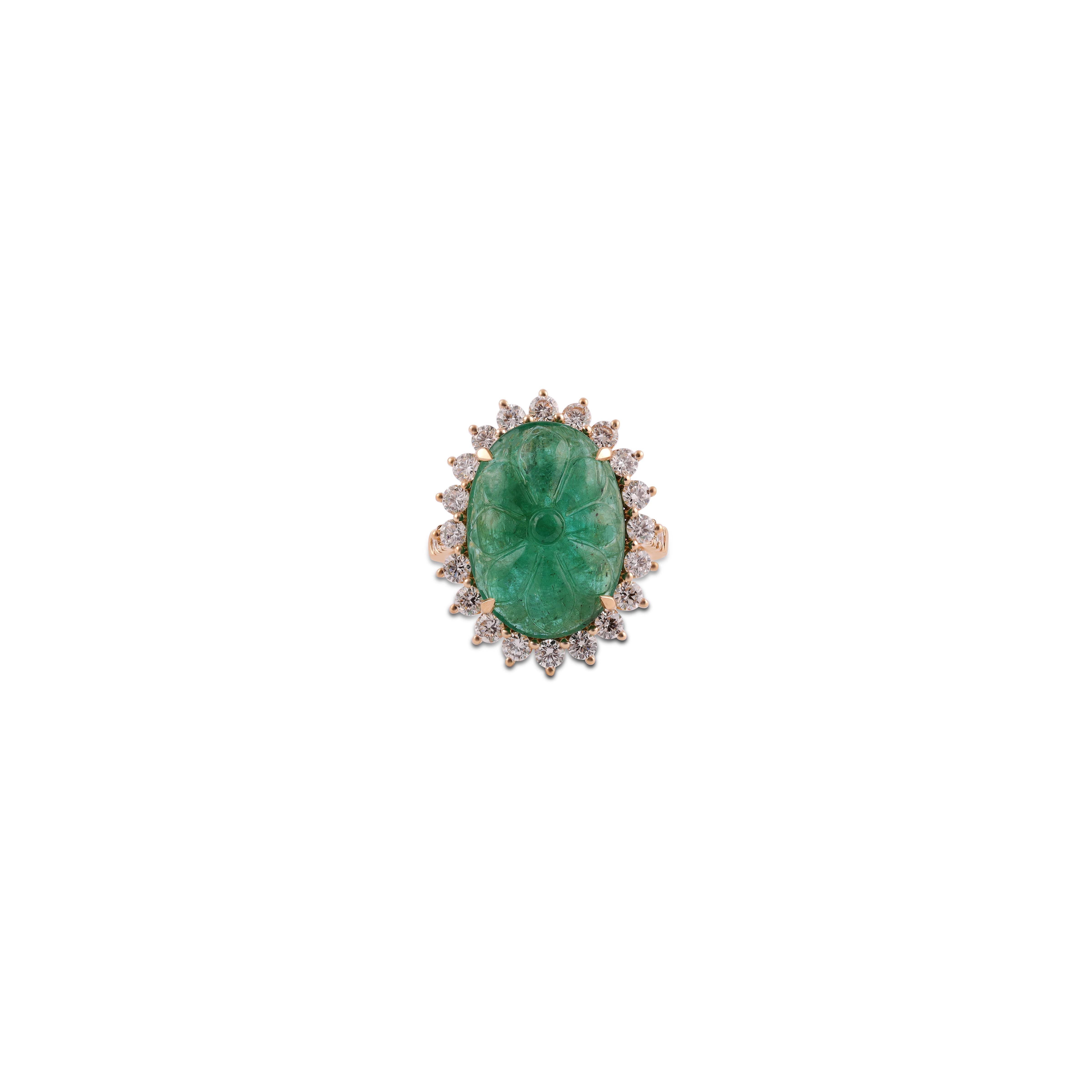 This is an elegant emerald & diamond ring studded in 18k Yellow gold with 1 piece of Carved Zambian emerald weight 11.15 carat which is surrounded by 30 pieces of round shaped diamonds weight 1.48 carat, this entire ring studded in 18k Yellow gold