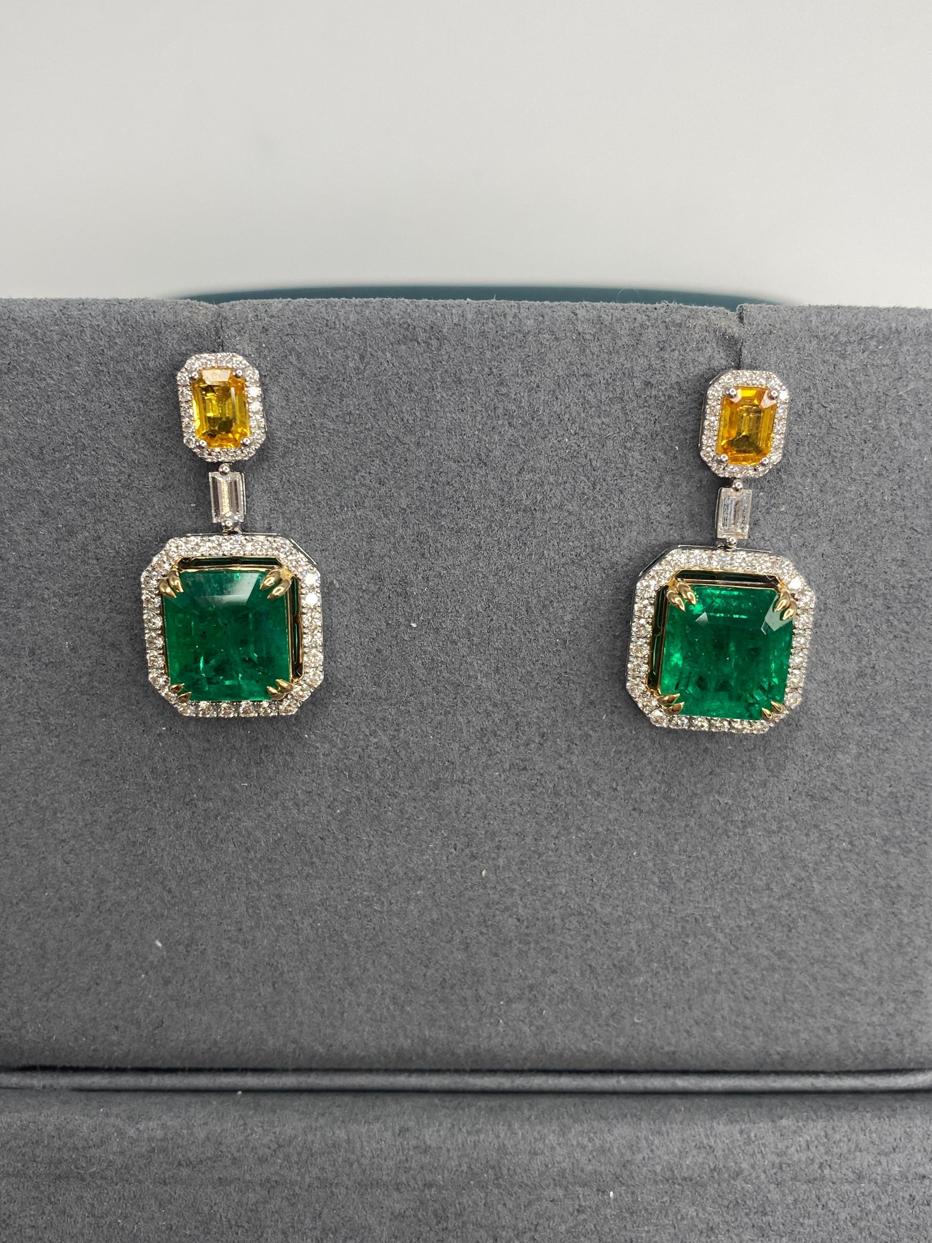 These one of a kind exquisite earrings featuring 2 emeralds 2 Yellow Topaz 92 diamonds will become “the jewel” in your collection. It is rare to find two emeralds of this size color and quality in nature. These beautiful octagon cut AIG certificated