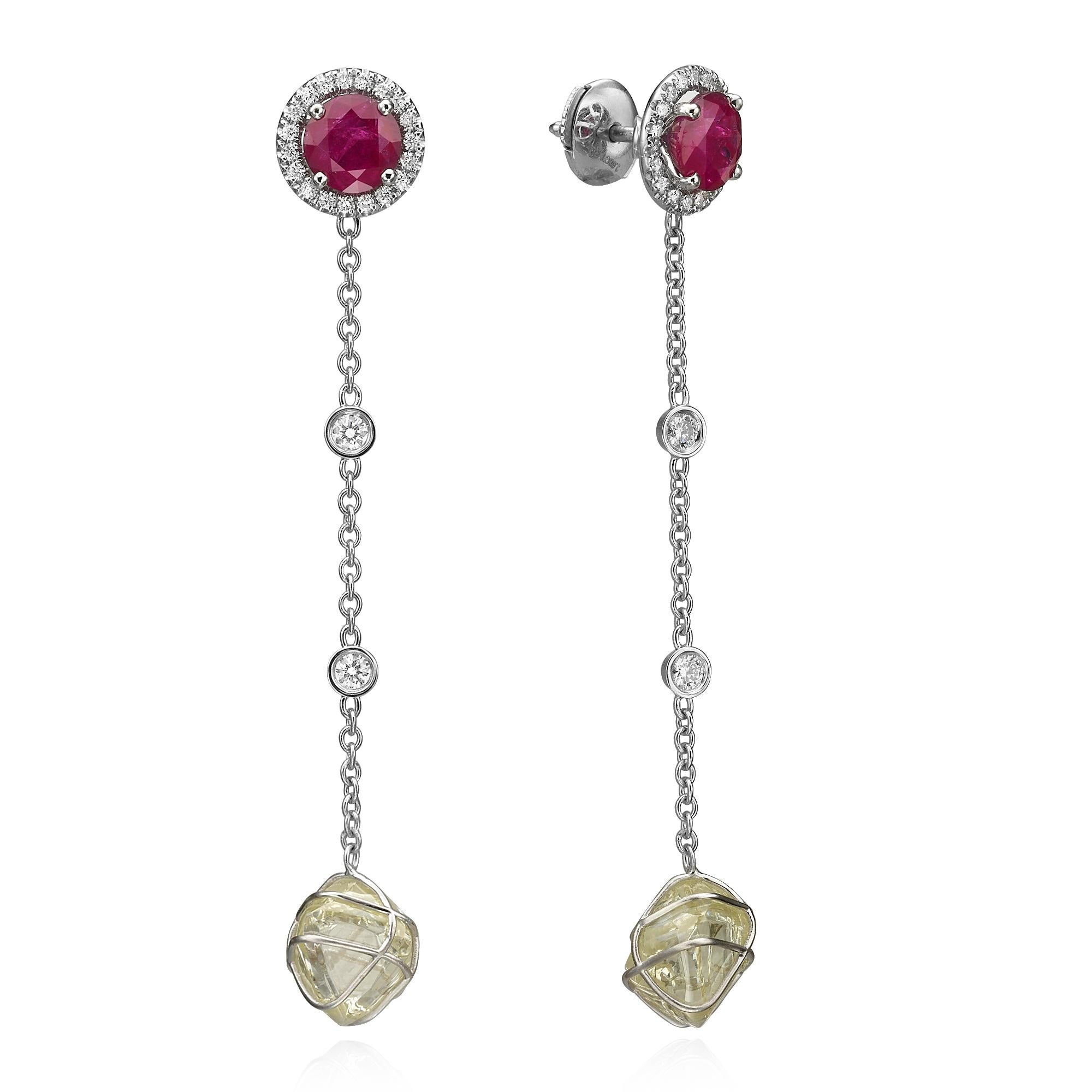 Our handcrafted Dangling earrings 11.15 carat TDW are made with detailed craftsmanship and one of a kind design. Natural Raw diamonds and High quality Round Brilliant Cut diamonds capture the beauty of a diamond evolution from raw to perfection.