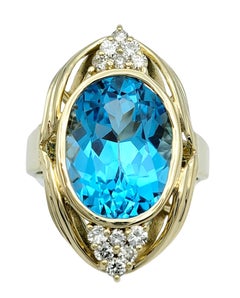 11.15 Carat Oval Cut Swiss Blue Topaz Cocktail Ring with Diamonds 14 Karat Gold