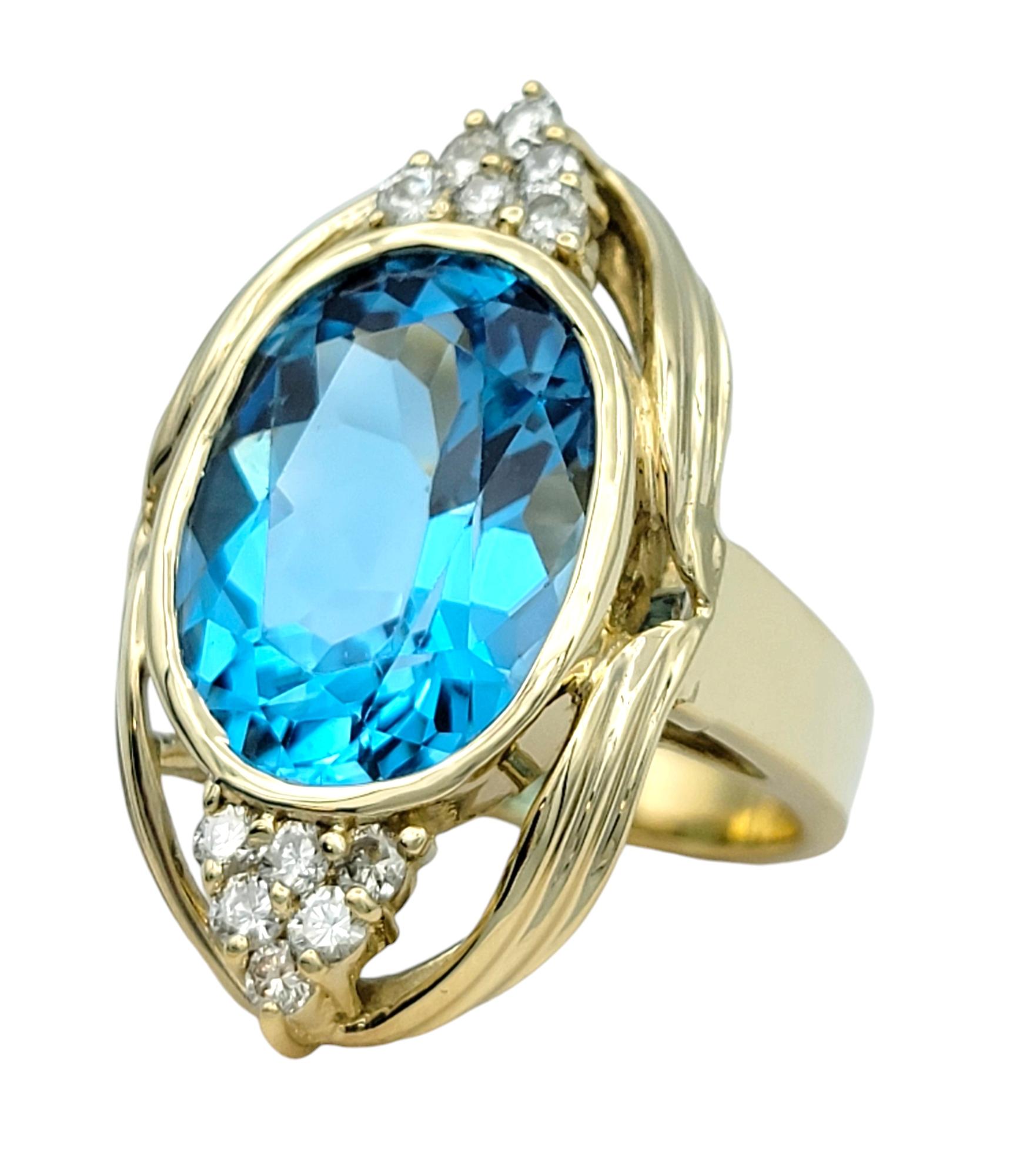 Contemporary 11.15 Carat Oval Cut Swiss Blue Topaz and Diamond 14 Karat Gold Cocktail Ring For Sale