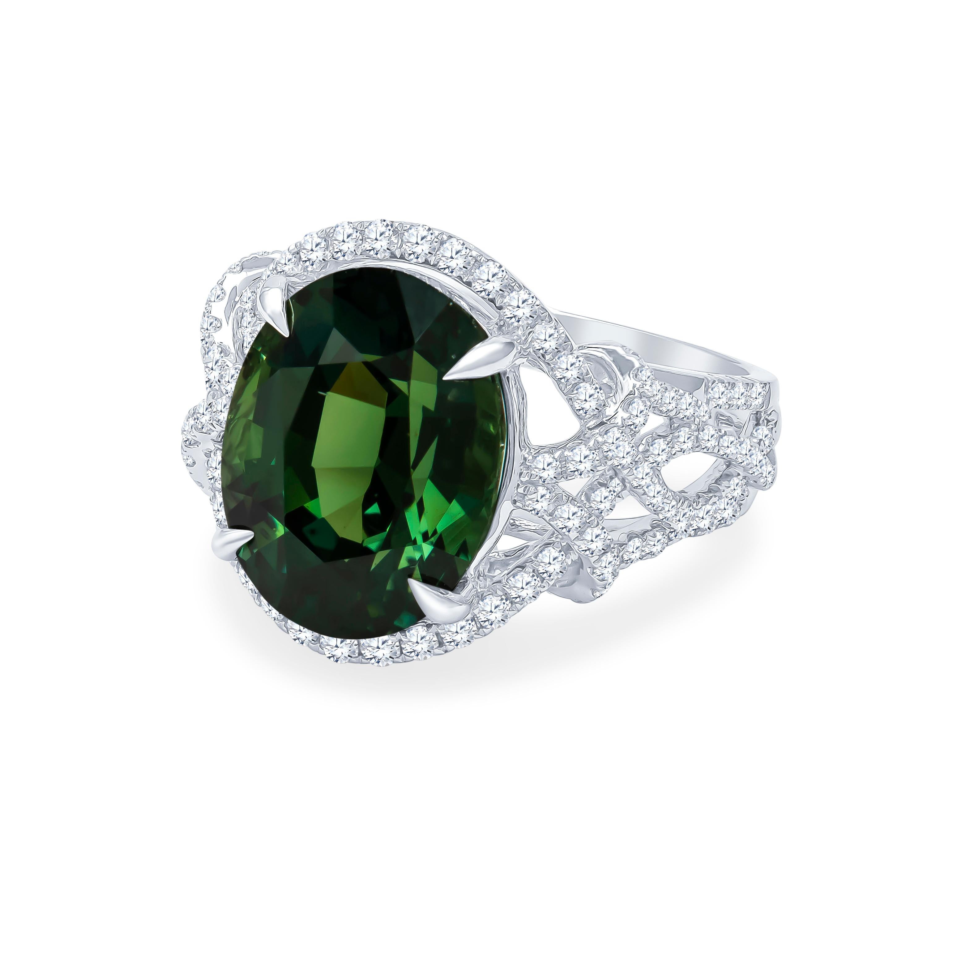 11.18 Carat natural oval cut green sapphire (GRS lab report) center stone with 0.80 carats total weight in fine round diamonds set in 18K white gold. The sapphire is a rich, beautiful forest green color with exceptional life which is difficult to