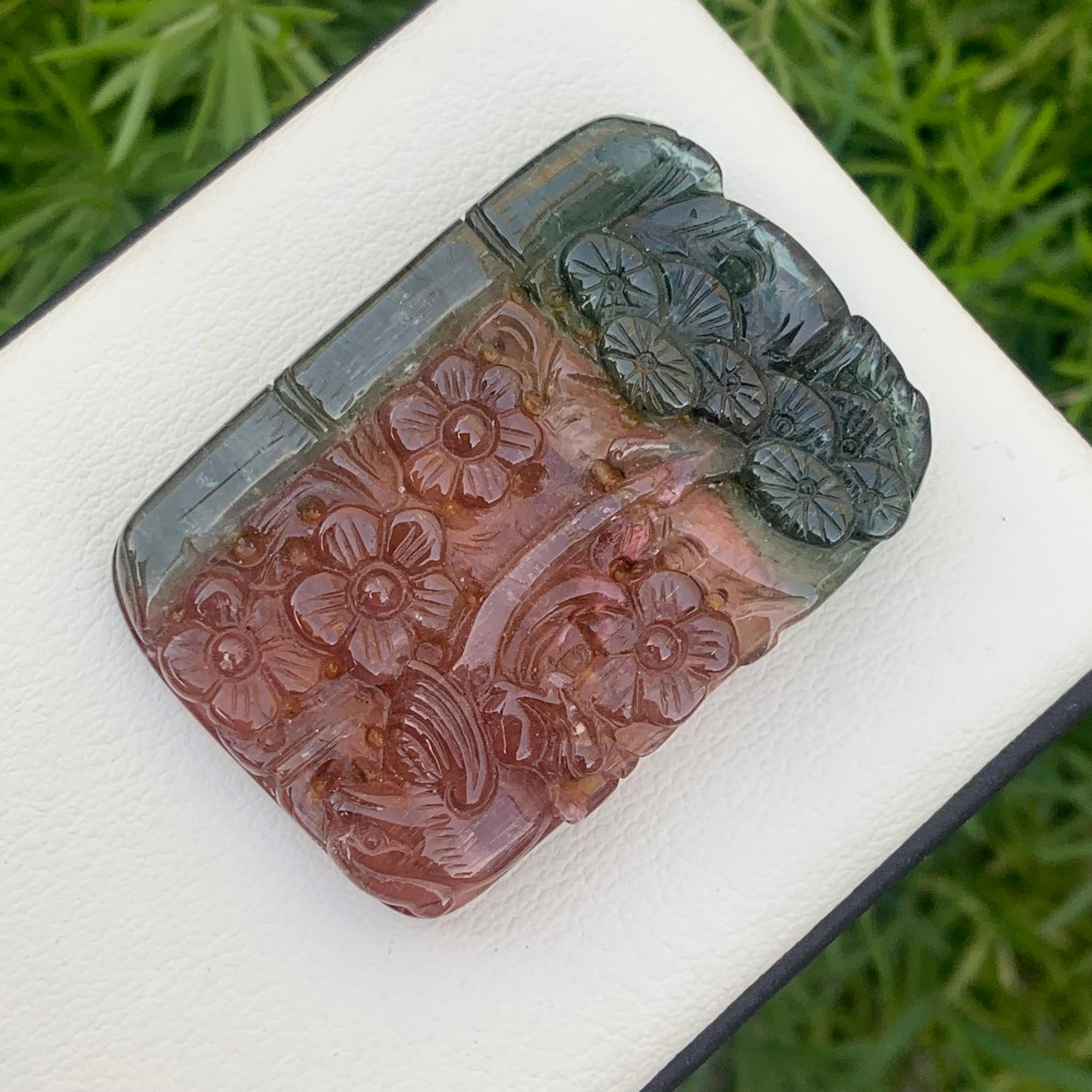 111.85 Carat Glamorous Natural Bi Color Flower Tourmaline Drilled Carving 
Weight: 111.85 Carats
Dimension: 4.4 x 3.0 x 0.7 Cm
Origin: Africa
Color: Red & Green
Shape: Carving
Quality: AAA
Bicolor tourmaline is connected to the heart chakra,