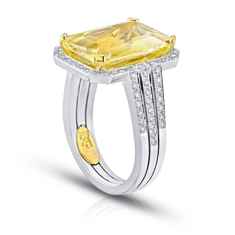 11.19 carat emerald cut yellow ceylon sapphire (no heat) with round diamonds .48 carats set in a platinum and 18k yellow gold ring
