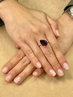 16.5mm x 11mm Natural Rhodolite Garnet and Diamond Cocktail Ring 18 Karat Gold