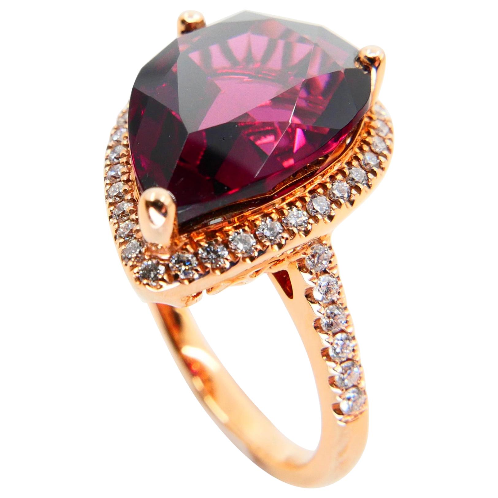 Contemporary 16.5mm x 11mm Natural Rhodolite Garnet and Diamond Cocktail Ring 18 Karat Gold For Sale
