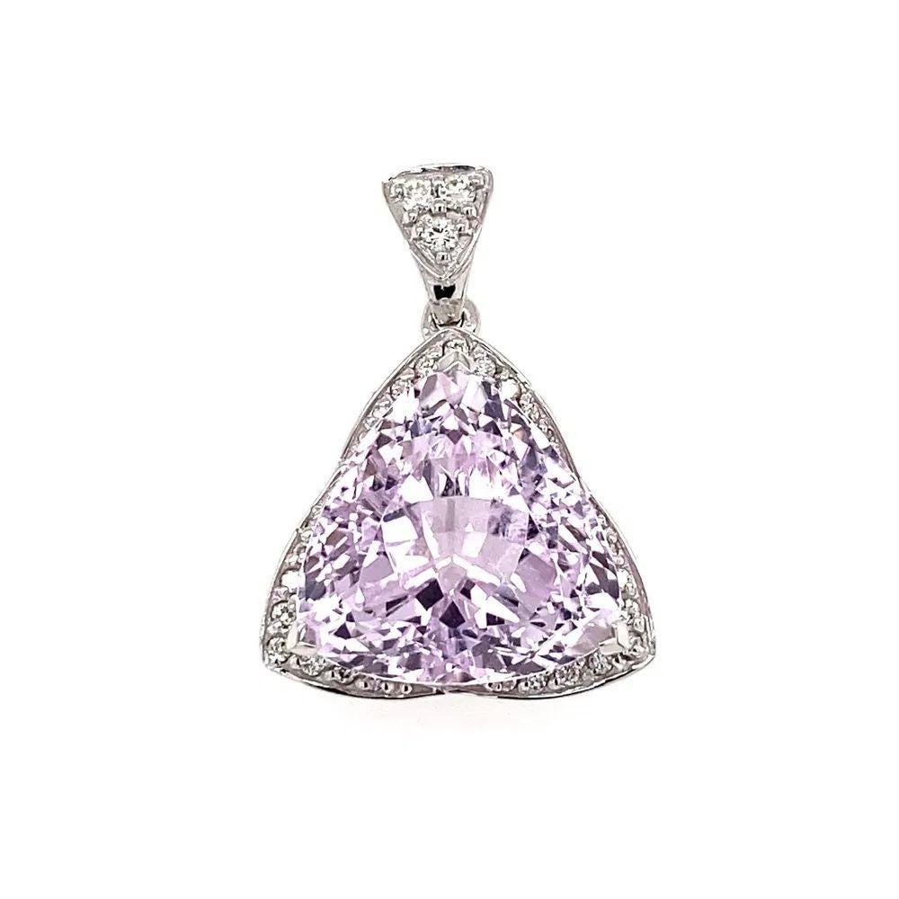 Simply Beautiful! Finely detailed Statement Trillion Kunzite and Diamond Gold Pendant. Featuring a securely Hand set Trillion Kunzite, weighing approx. 11.19 Carats. Enhanced with Diamonds, approx. 0.15tcw. Hand crafted 18K White Gold mounting and