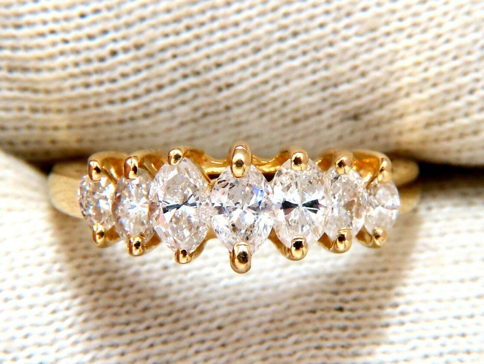 1.11ct. Natural diamonds cathedral band.

Marquise, Full cut Brilliants 

I-color I-1 clarity.

14Kt yellow gold.

3.1 Grams

Ring is 6.6mm wide

Depth:  6.7mm

size 7

Resizing Service is available.