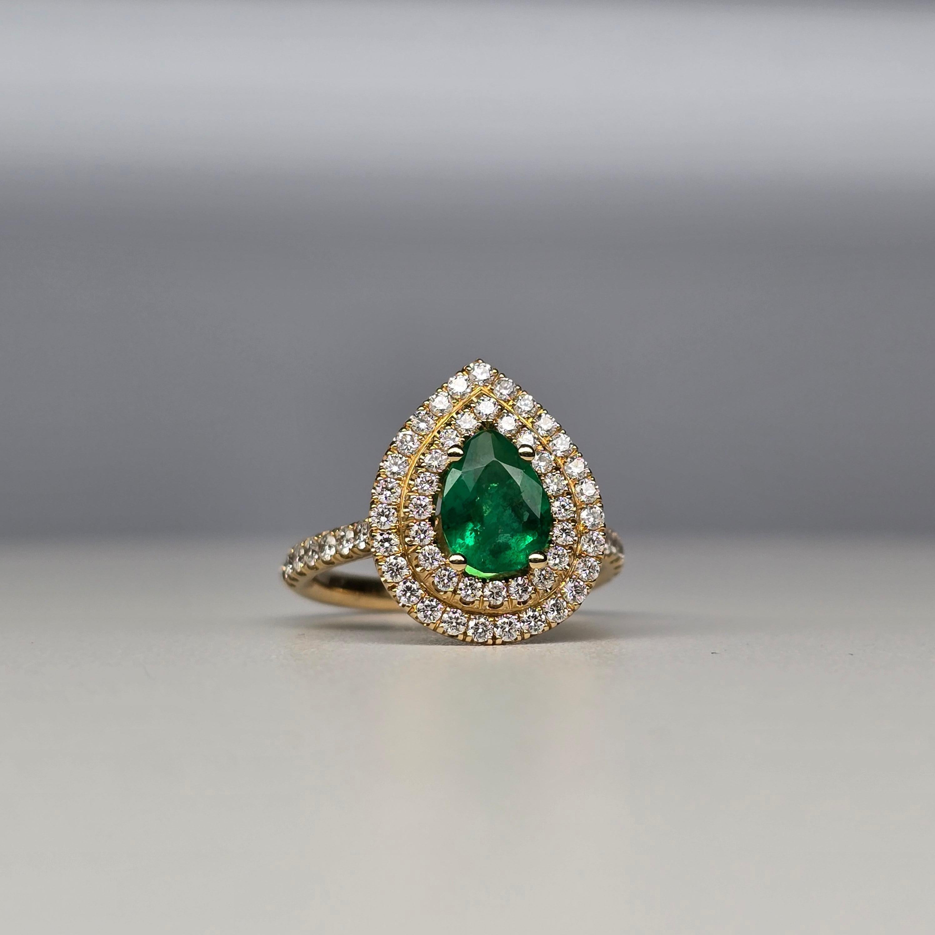 Stunning pear shape emerald engagement ring with natural diamonds in 18KT gold.


NATURAL DIAMOND(S)
Clarity/Color: VS-SI/F-G
Carat:0.79ct
Cut: Round Brilliant
NATURAL EMERALD
Clarity/Color: Moderately Included/Green
Cut: Pear
Carat:1.11ct
size: