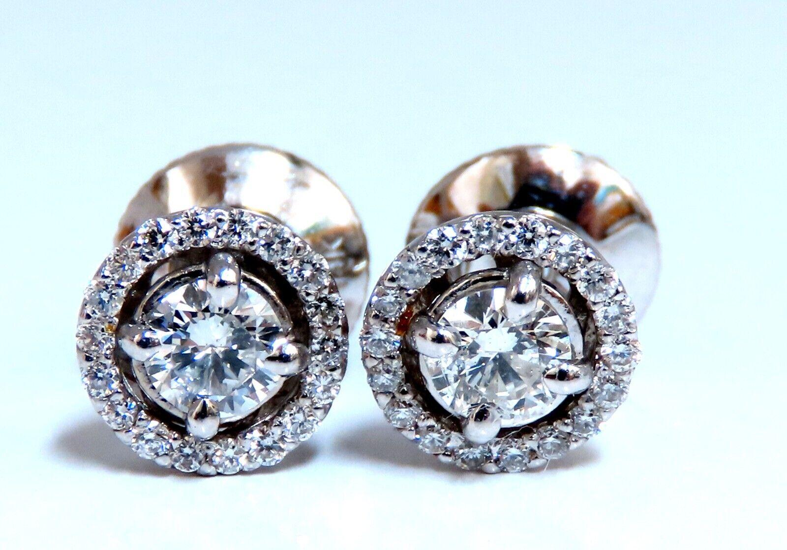 Cluster diamond earrings.

Natural round diamonds

.40ct center (2) diamonds.

.71ct side diamond accents.

G - color vs2  clarity

14 karat white gold 2.2 grams

Earrings measure 7mm wide

$4,000 appraisal certificate to accompany