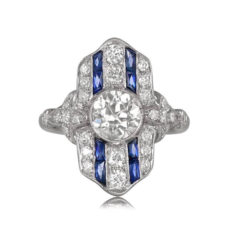 Elegance takes center stage in this elongated diamond ring, featuring a handcrafted platinum setting adorned with diamonds and sapphires on the gallery. The centerpiece is an Old European Cut diamond, approximately 1.11 carats, displaying K color