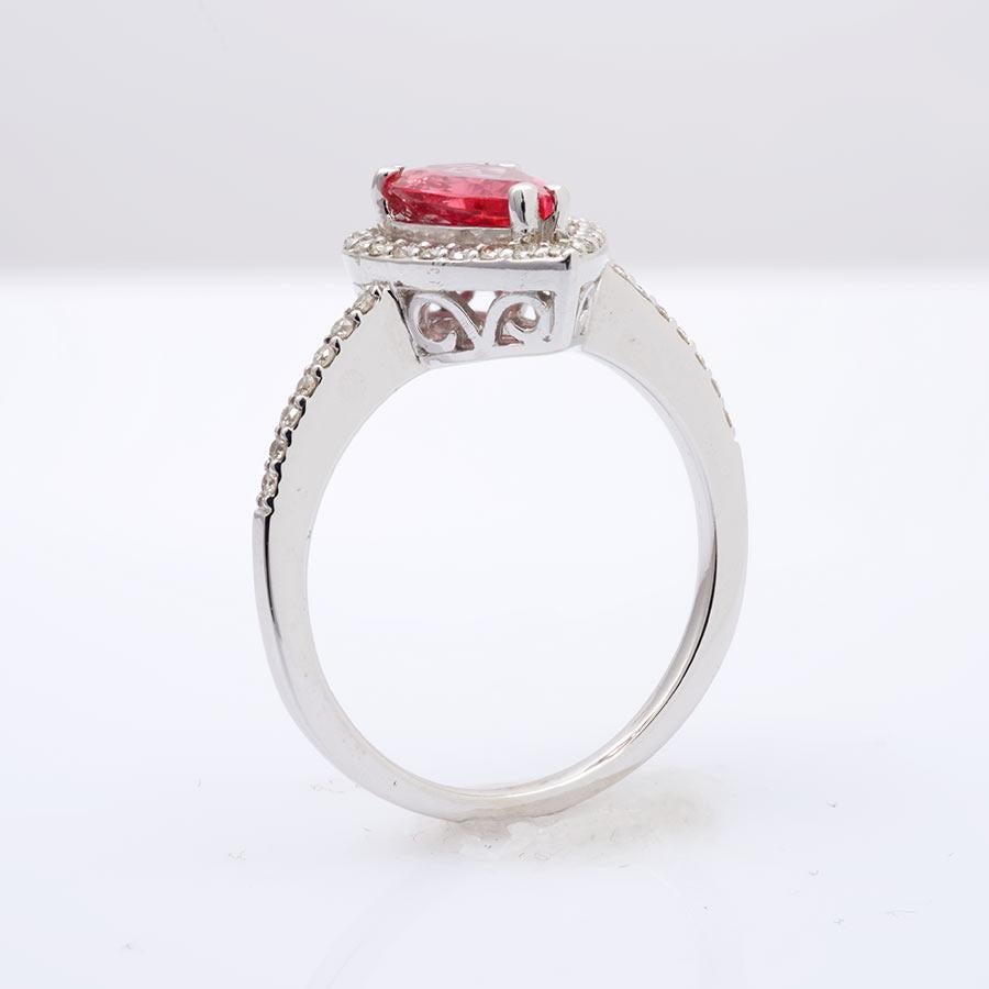This pear shaped Spinel weighing 1.12 carats featured at the center of this ring will take your breath away. Fashioned in 14K white gold the ring has diamonds matched to perfection glittering on its shoulders. Its intricate design will be just the