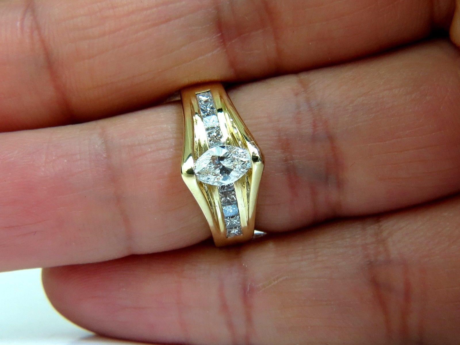 Marquise Tension + Princess Cuts

Deco diamond ring.



Center diamond: .52ct.

Marquise diamond Excellent full cut.

6 X 4.2mm

.60ct. Princess cut diamonds.

G color 

Vs-2 clarity

18kt. yellow gold.

7 grams.

current size: 6.5

(we can resize,