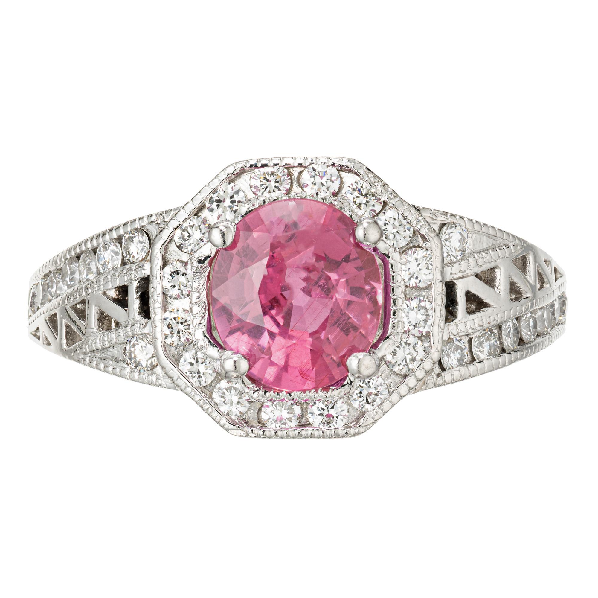Art Deco original Halo style hot pink Sapphire engagement ring. GIA certified no heat, no enhancement 1.12 hot pink sapphire center stone. Set in its original 1940's platinum setting accented with 34 full cut round diamonds. 

1 oval hot pink