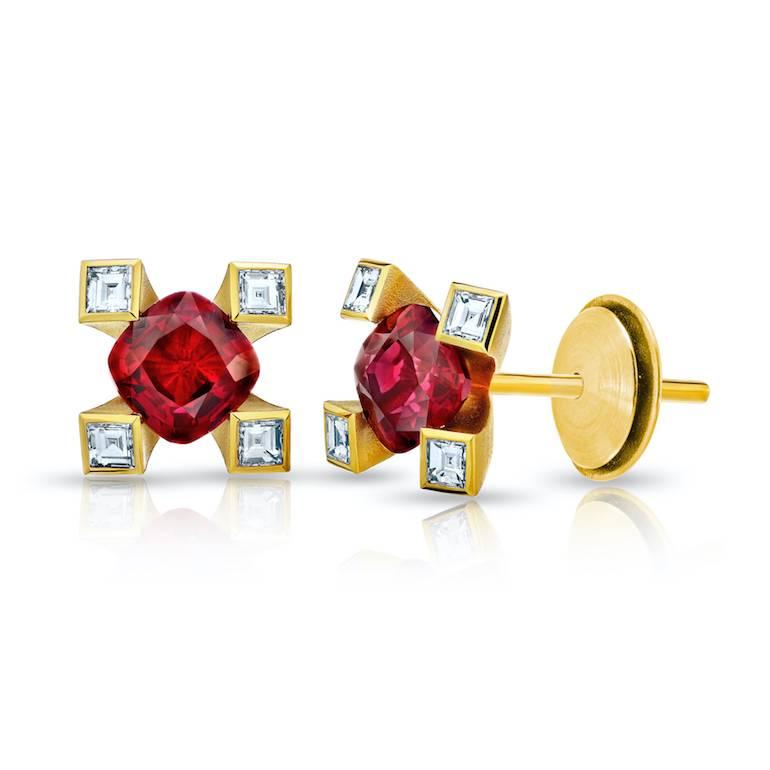 Two matched cushion cut red rubies weighing 1.12 carats set with eight carre cut diamonds (F+/VVS) weighing .21 carats in 18k yellow gold earrings
