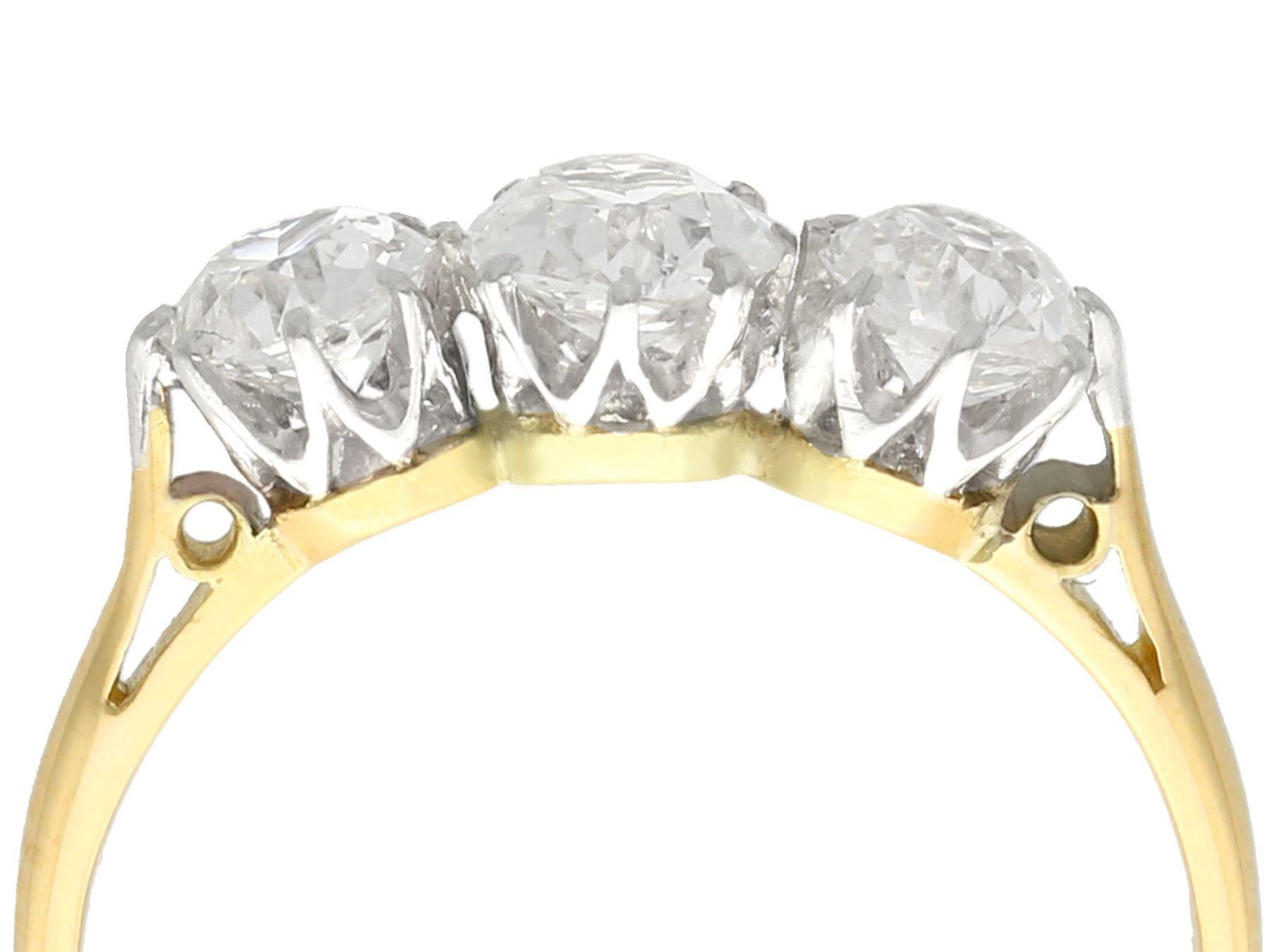 A fine and impressive antique 1.12 carat diamond and 18 karat yellow gold, platinum set trilogy ring; part of our diverse antique jewelry and estate jewelry collections.

This fine and impressive antique trilogy ring has been crafted in 18k yellow