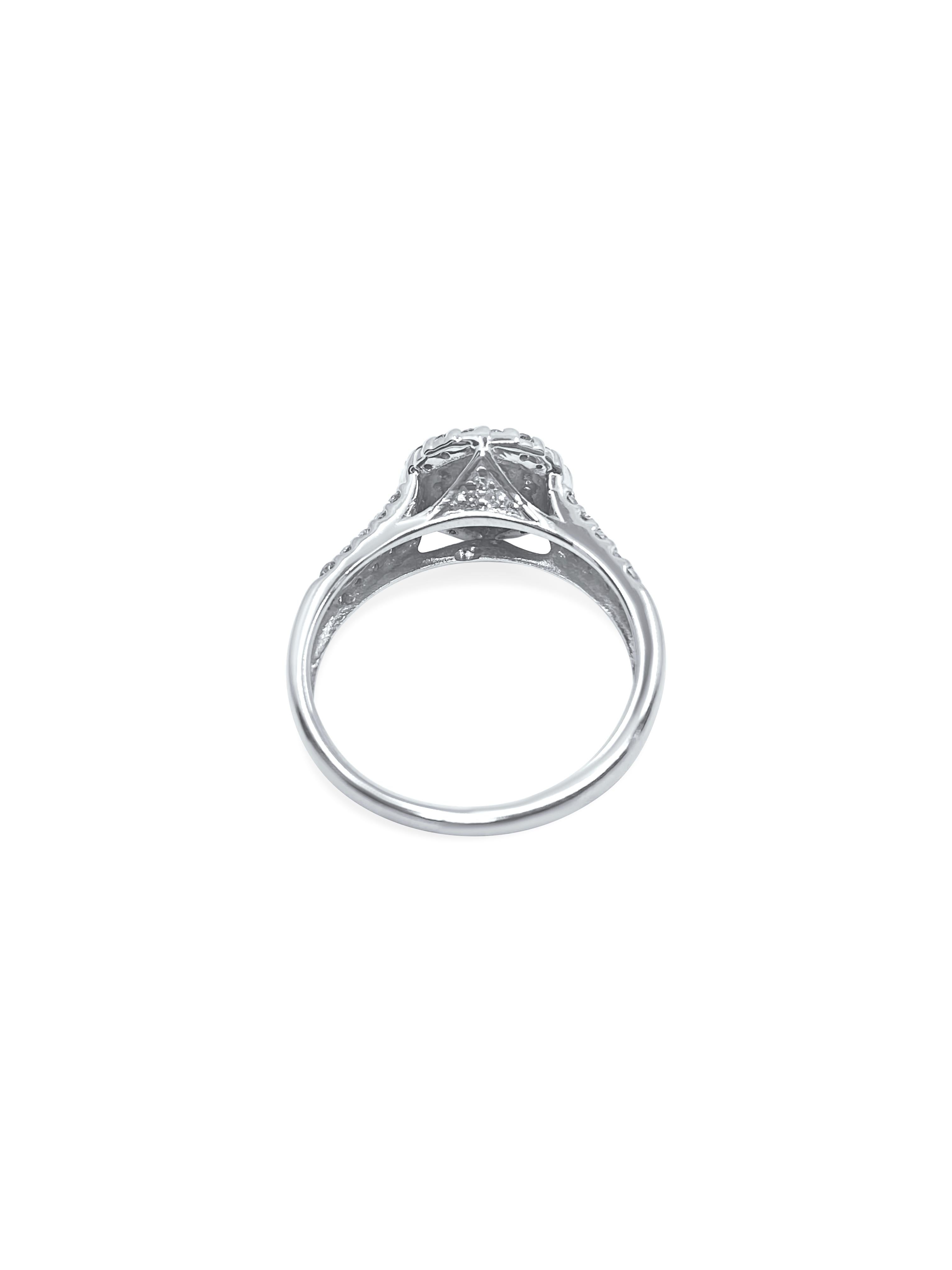 In stunning 14k white gold, this art deco-style diamond ring features a total of 1.12 carats of natural earth-mined diamonds. With a mix of round brilliant, marquise, and baguette cuts, these diamonds offer a captivating display. The diamonds boast