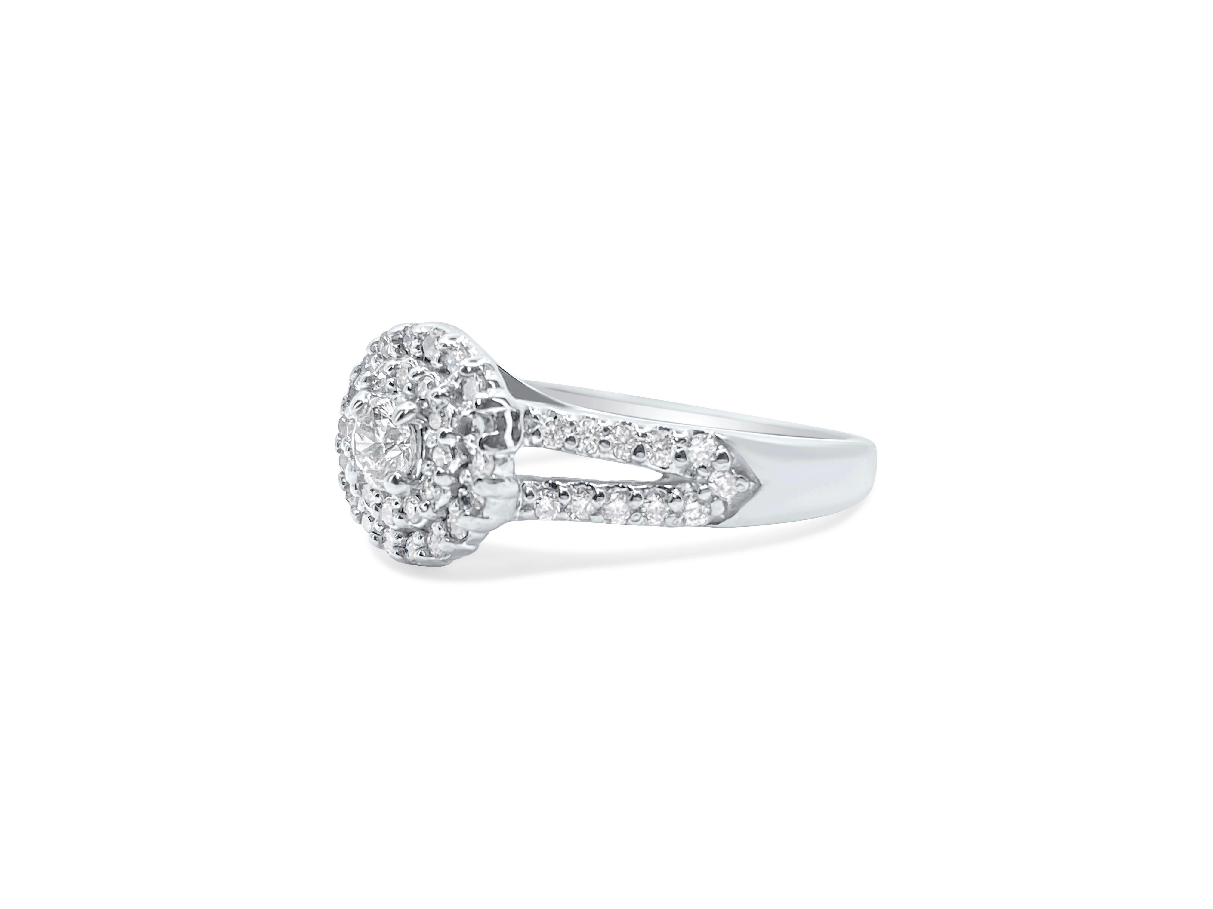 In stunning 14k white gold, this art deco-style diamond ring features a total of 1.12 carats of natural earth-mined diamonds. With a mix of round brilliant, marquise, and baguette cuts, these diamonds offer a captivating display. The diamonds boast