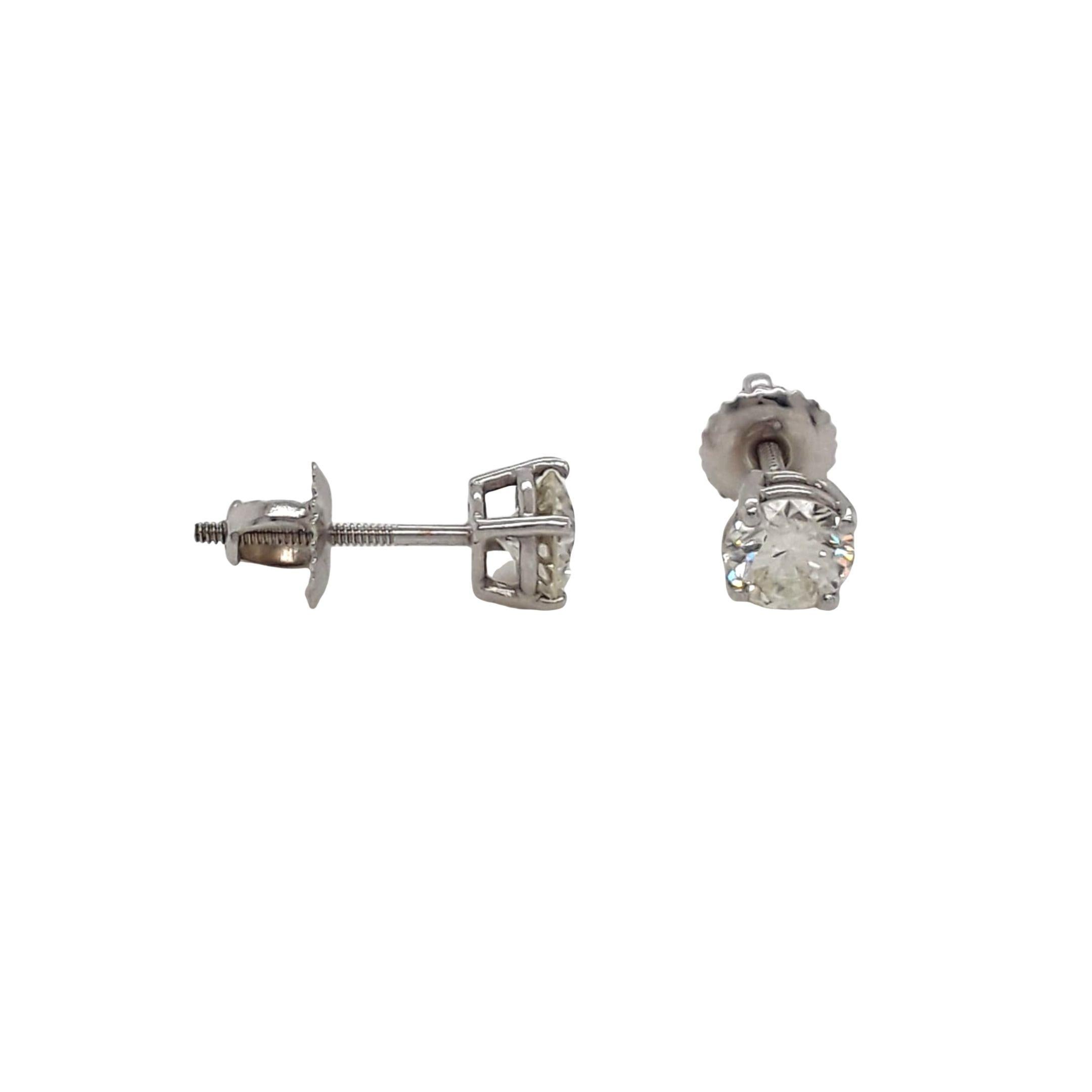 Diamond Stud Earrings made with natural brilliant cut diamonds. Total Weight: 1.12 carats, Stone Diameter: 5.23 x 5.25. Set on a 4 prong mounting in 18 karat white gold, screw back setting. 