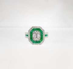1.12 Carat Emerald and Diamond Halo Ring with Emerald Cut Center Diamond