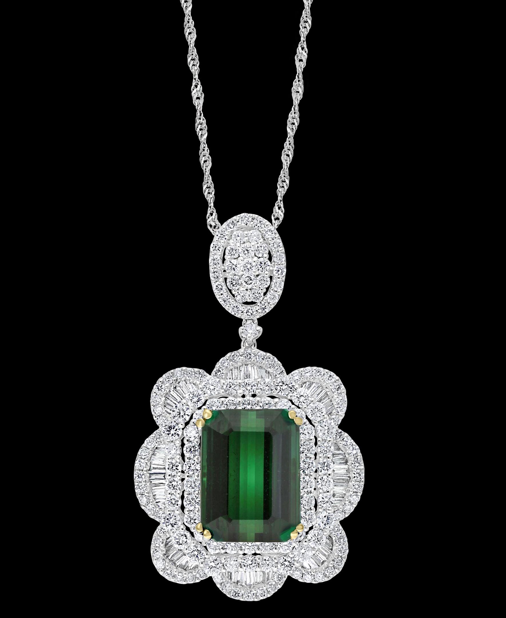   11.2 Carat Green Tourmaline & 4.5 Carat Diamond Pendant / Necklace 18 Karat Gold, Estate
This spectacular Pendant Necklace  consisting of a single Cushion  Shape Green Tourmaline  11.22 Carat.  The  Green Tourmaline  is surrounded by approximately