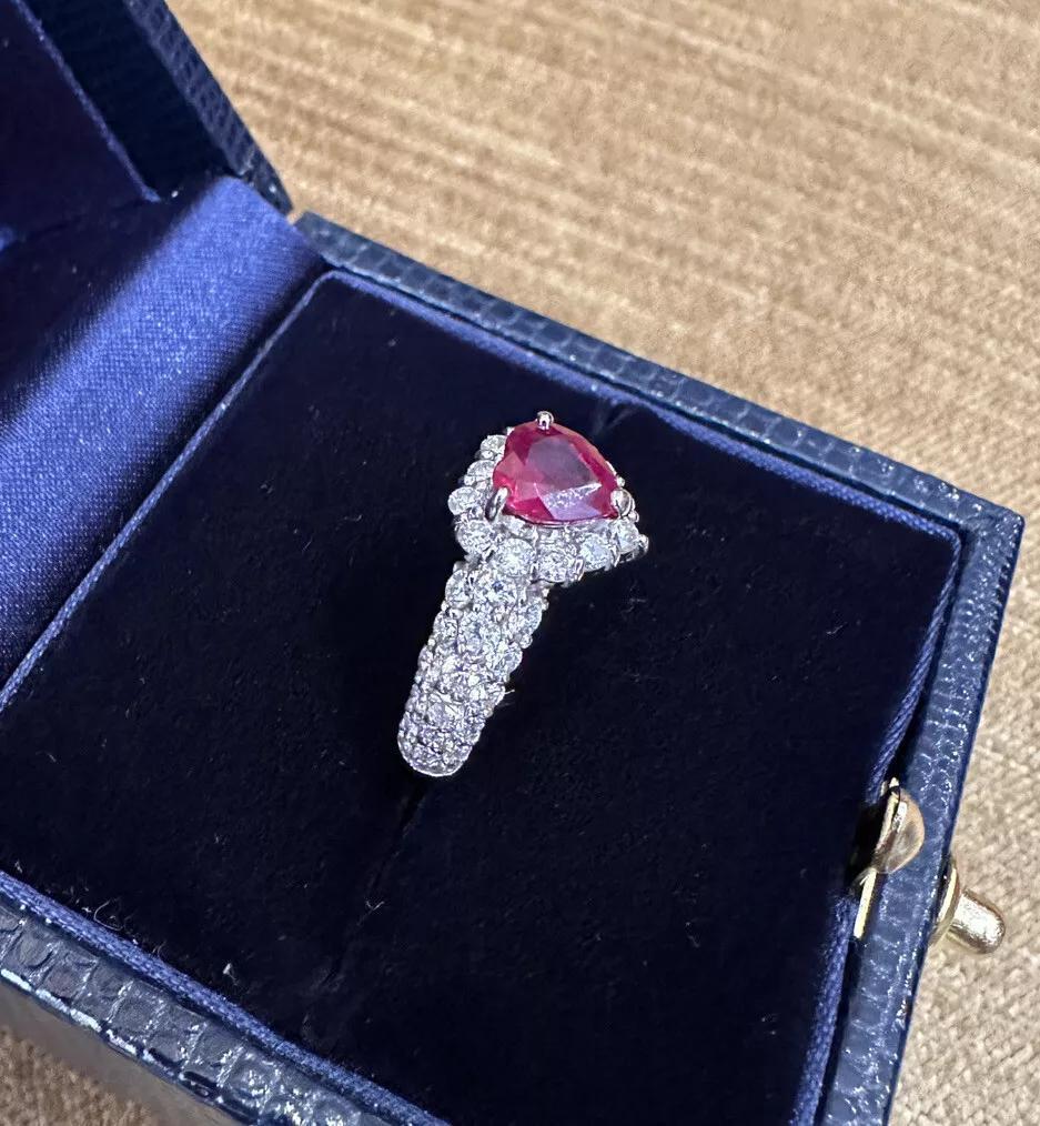 1.12 carat Heart Shaped Ruby and Diamond Ring in Platinum 

Ruby and Diamond Ring features a Heart Shaped Ruby with Deep Red color weighing 1.12 carats surrounded by a halo of pave set Round Brilliant Diamonds with Diamonds on the shank, all set in