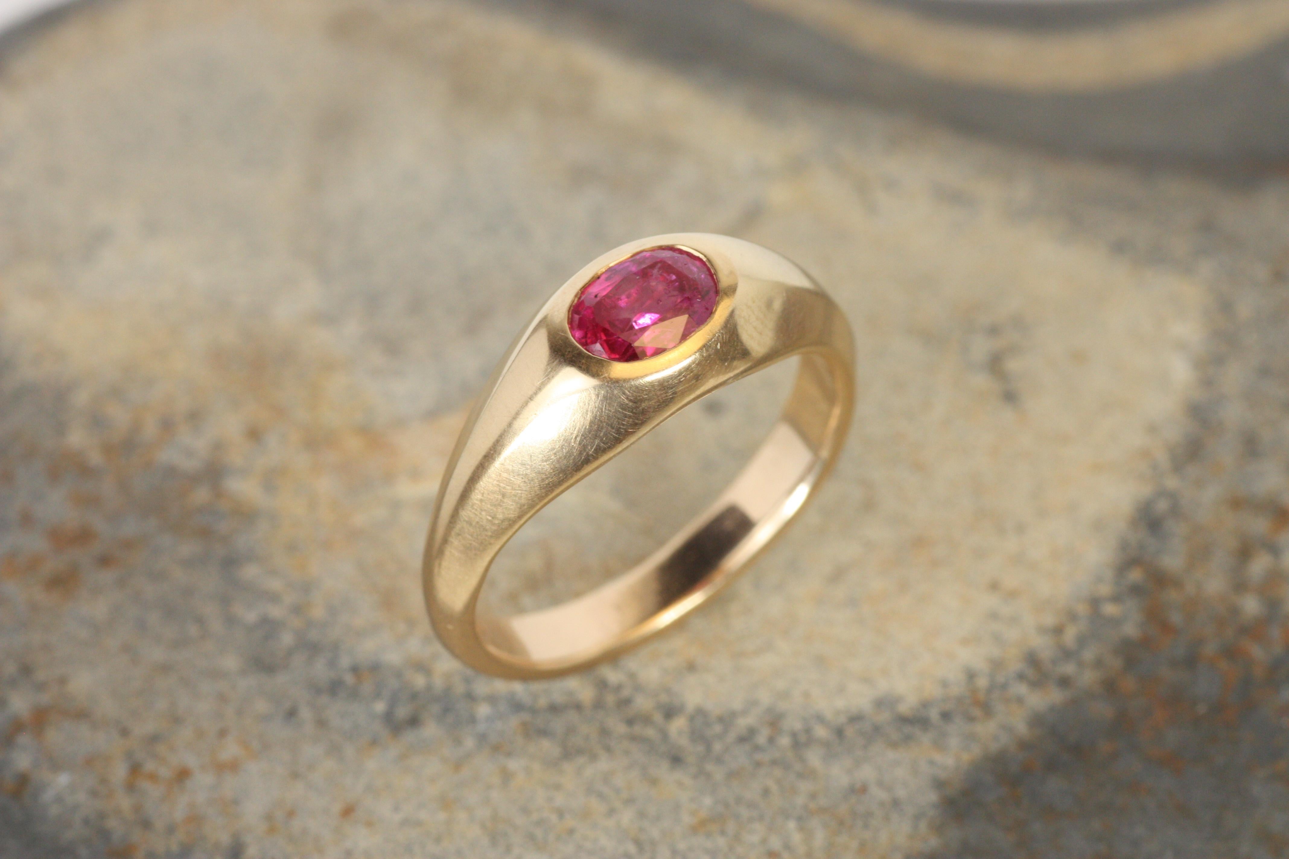 A stunning faceted Burmese ruby takes center stage in this one-of-a-kind gypsy ring. The vivid 1.12ct oval gemstone is set in warm 14K rose gold, and the soft-hammered finish of the beveled shank adds artisanal texture. This ring makes a bold yet