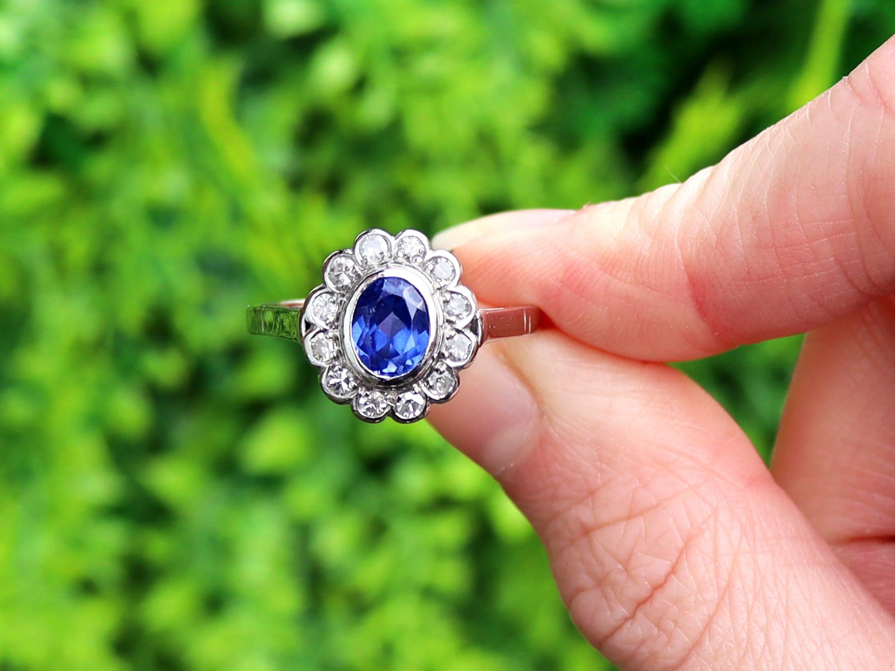 A fine and impressive 1.12 carat sapphire and 0.48 carat diamond, platinum cocktail ring; part of our antique estate jewelry collections.

This stunning, fine and impressive antique oval cut blue sapphire ring has been crafted in platinum.

The oval