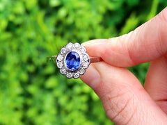1.12 Carat Oval Cut Sapphire and Diamond Platinum Cluster Ring