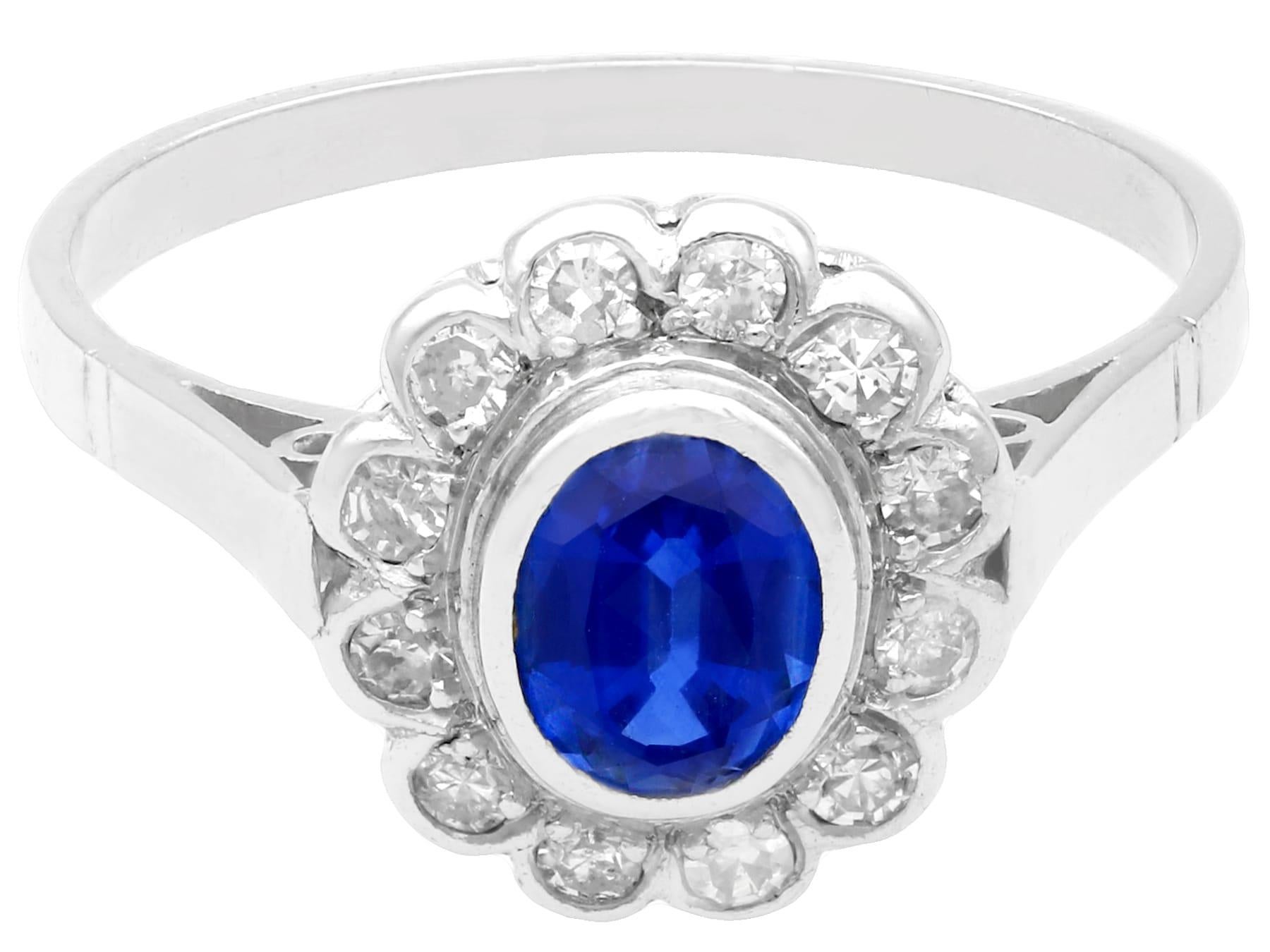Women's 1.12 Carat Oval Cut Sapphire and Diamond Platinum Cluster Ring Circa 1930 For Sale