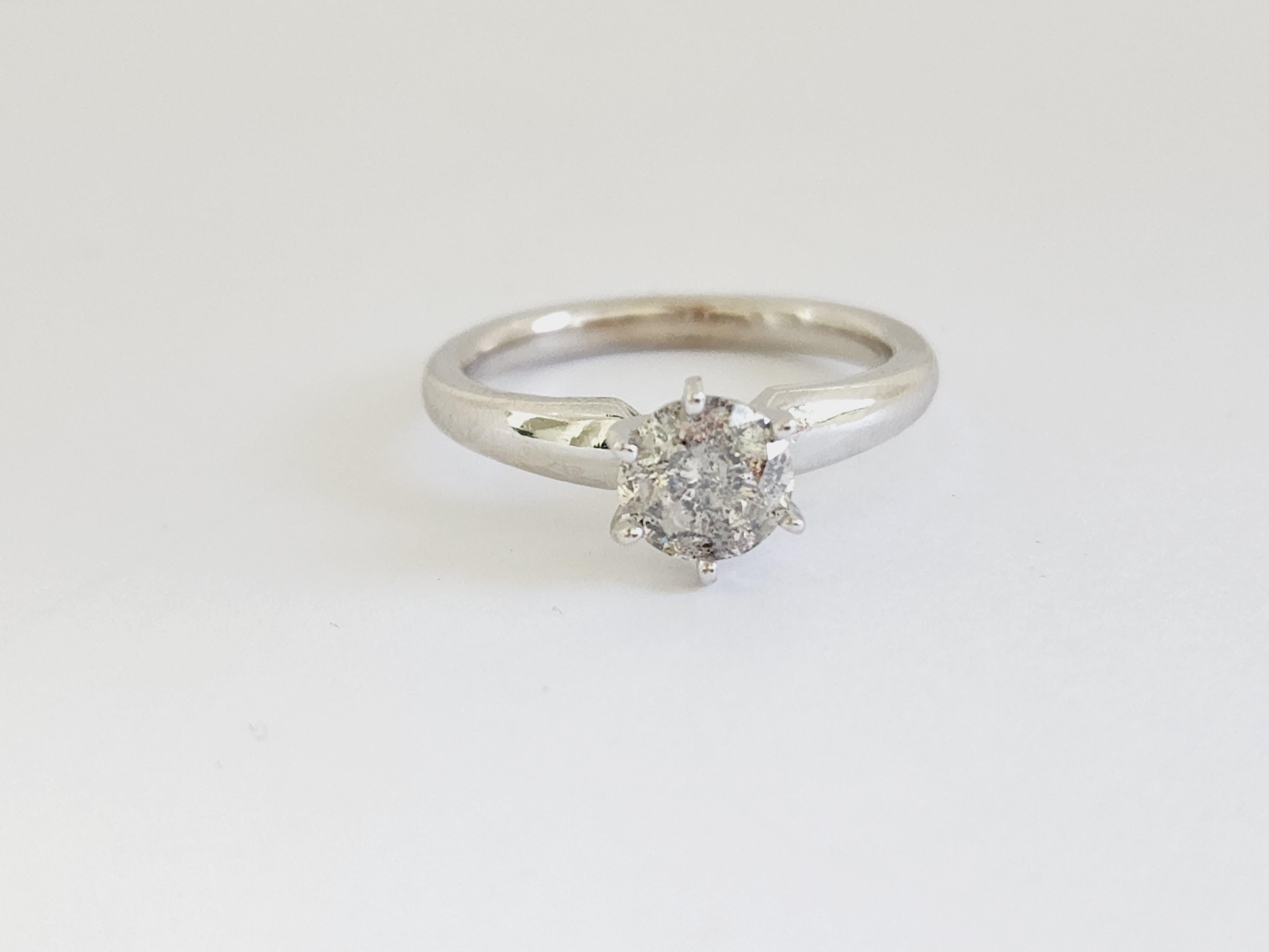 1.12 ct round brilliant cut natural diamonds. 6 prong solitaire setting, set in 14k white gold. 
Ring Size 7