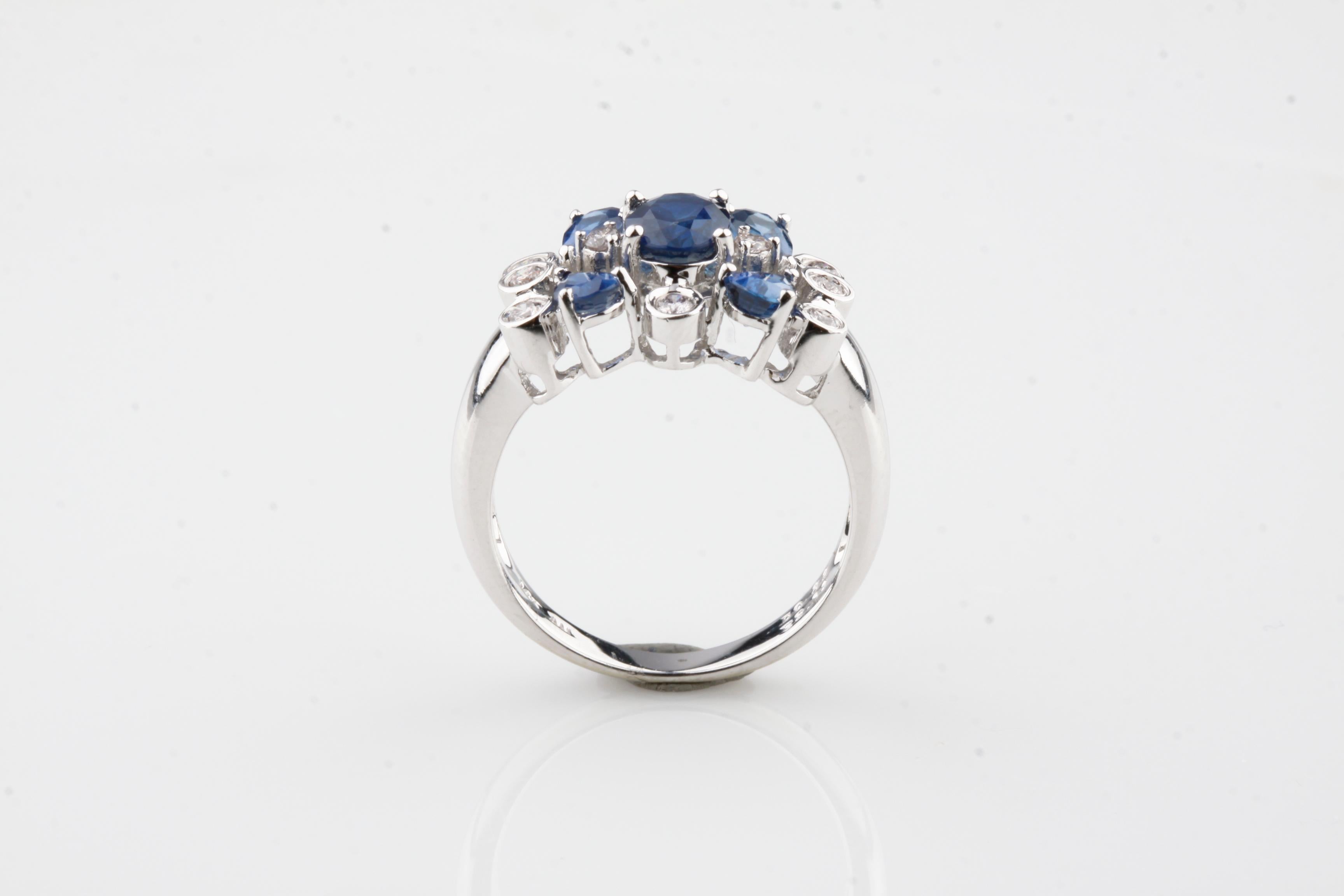 Modern 1.12 Carat Sapphire and Diamond Cluster Ring in White Gold For Sale