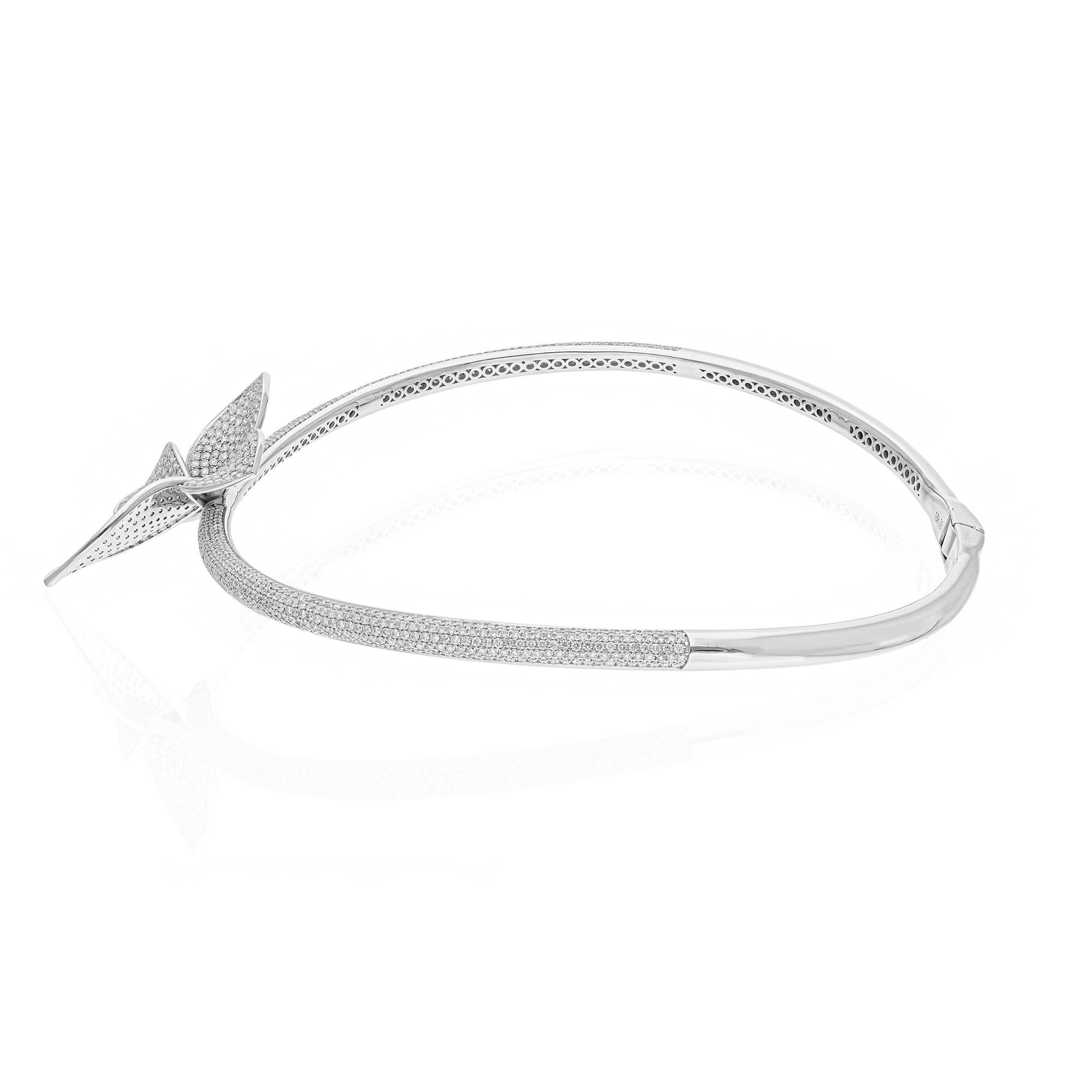 This luxurious butterfly choker necklace showcases 11.20 carats of natural brilliant cut diamonds, meticulously set in 14 karat white gold. Weighing a total of 52.48 grams, including 50.24 grams of white gold, this exquisite piece combines elegance