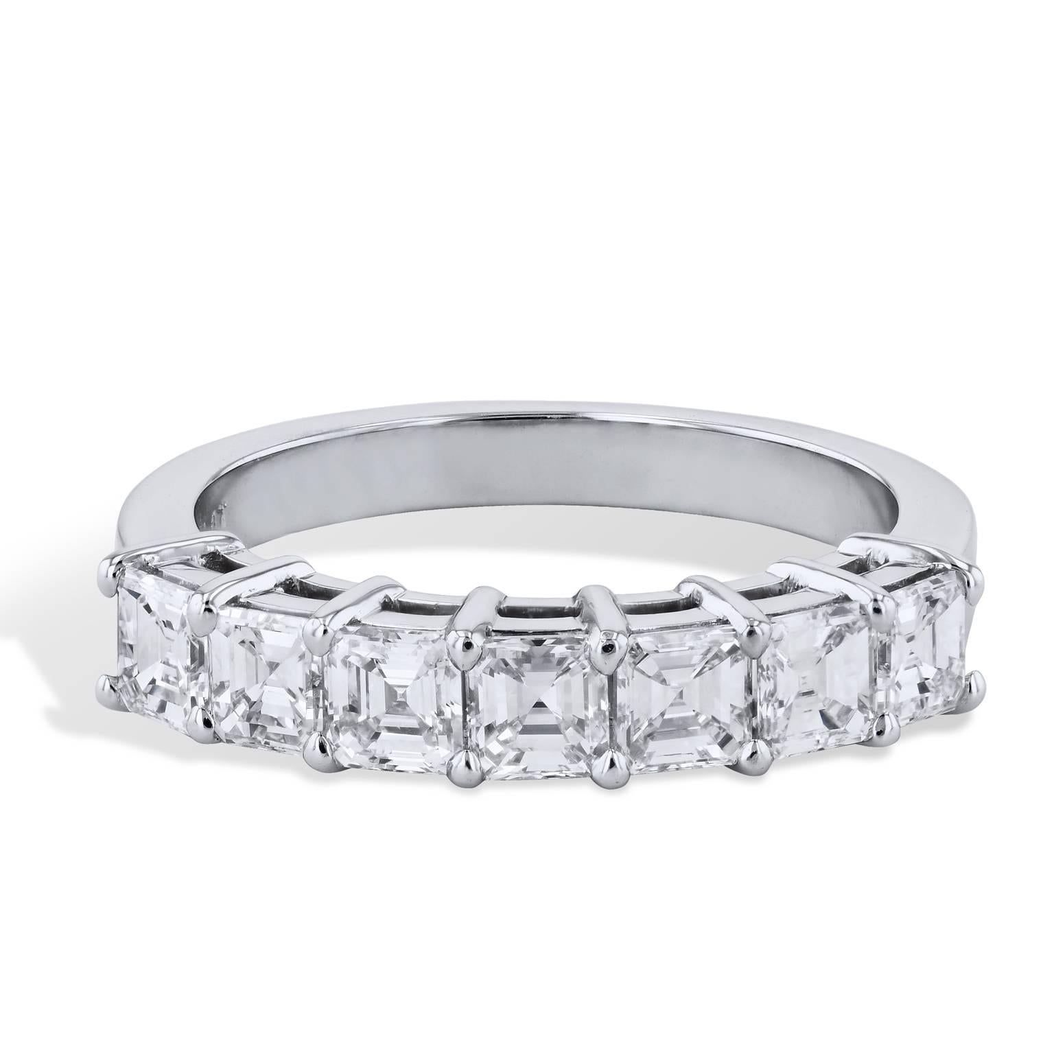 1.12 carat of square emerald cut diamond are affixed to a platinum shared-prong shank. This previously loved band ring provides a spectrum of light and color that glinters with pristine beauty (size 4).