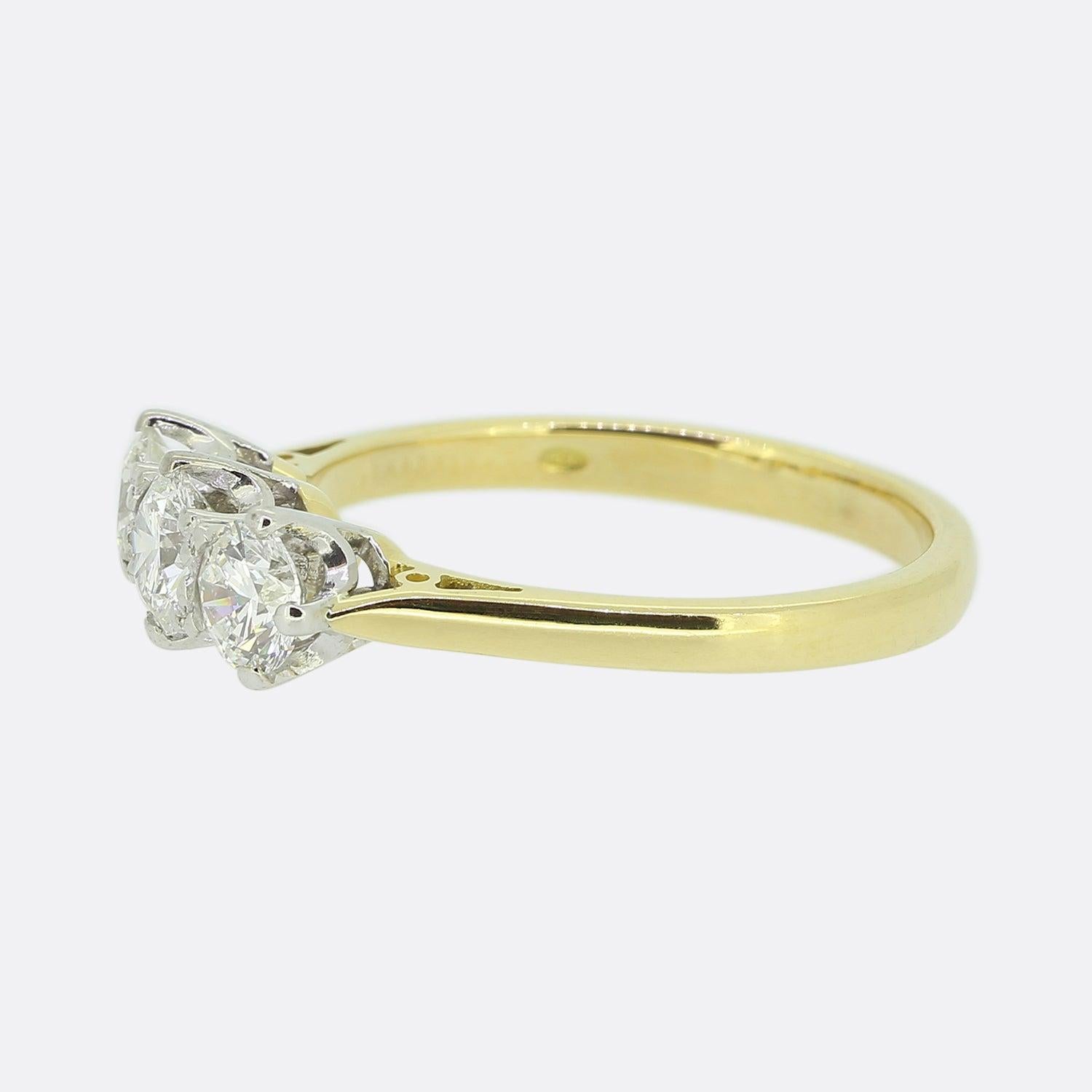 Here we have a wonderful three-stone diamond ring. This contemporary piece showcases a trio of round brilliant cut diamonds with the centre stone being slightly larger than it's two counterparts. Each bright white diamond has been claw set in