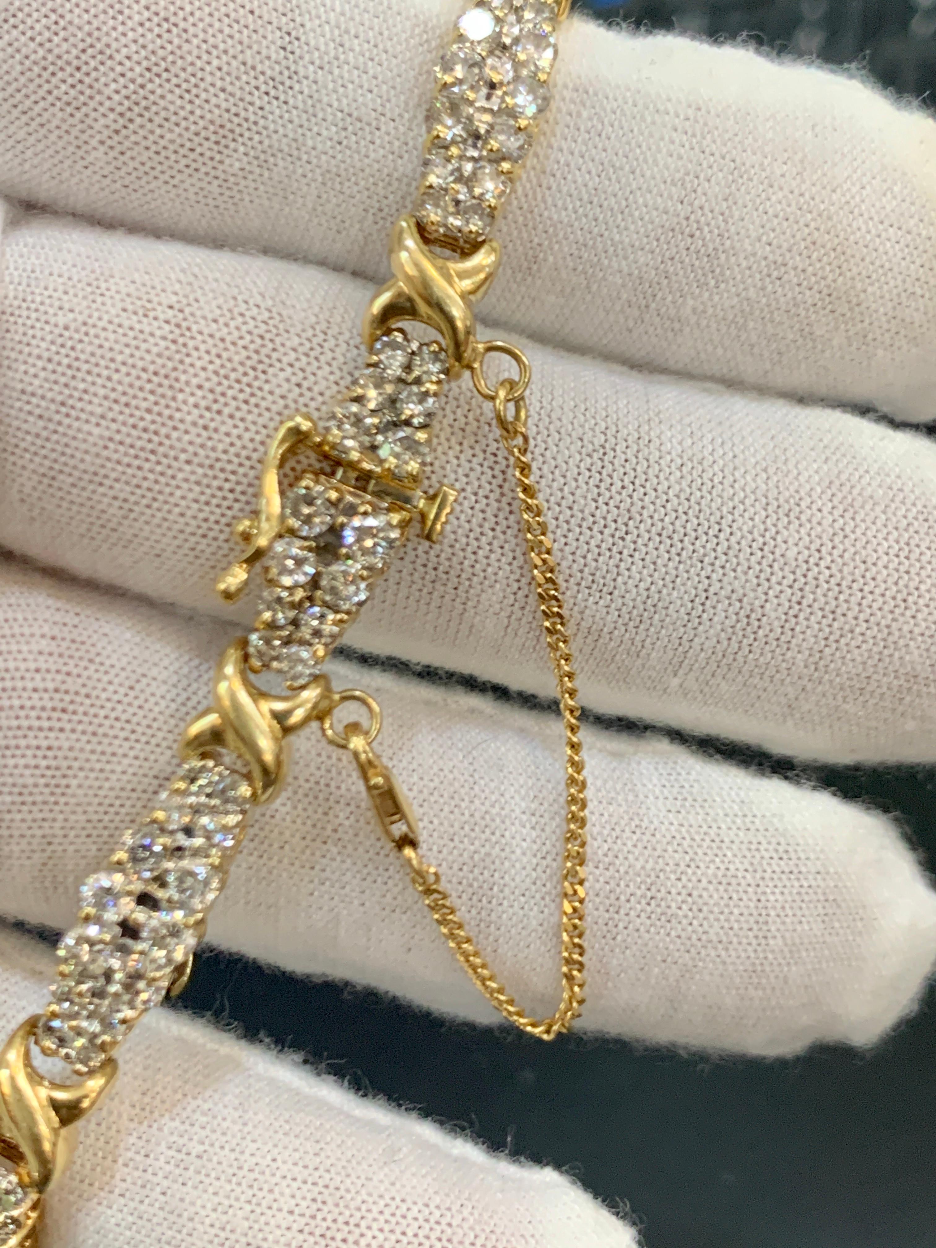 112 Diamond 5 Carat Bracelet ,14 Karat Yellow Gold 17.7 Gm Estate, Secured Chain
A statement of true, classic elegance, this 14 karat  Gold  Bracelet with Brilliant round  Diamond  from signature collection. The interlocking gold links, in between