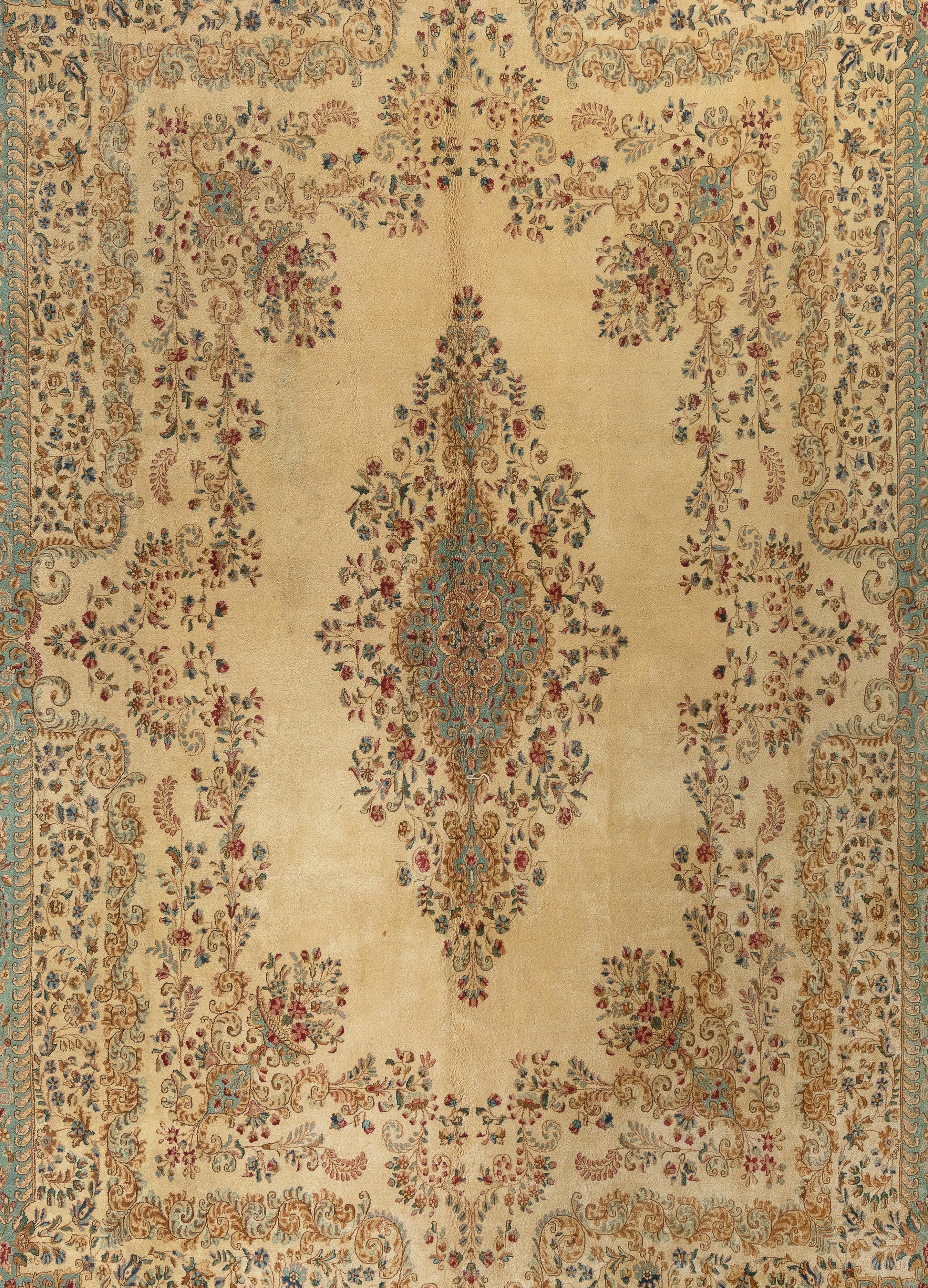 This exquisite vintage Persian Kerman rug has a very fine texture of soft lamb's wool on a tightly woven cotton foundation. With its incredibly well drawn details, the rug is a splendid piece to behold in delight. It features delicate flowering