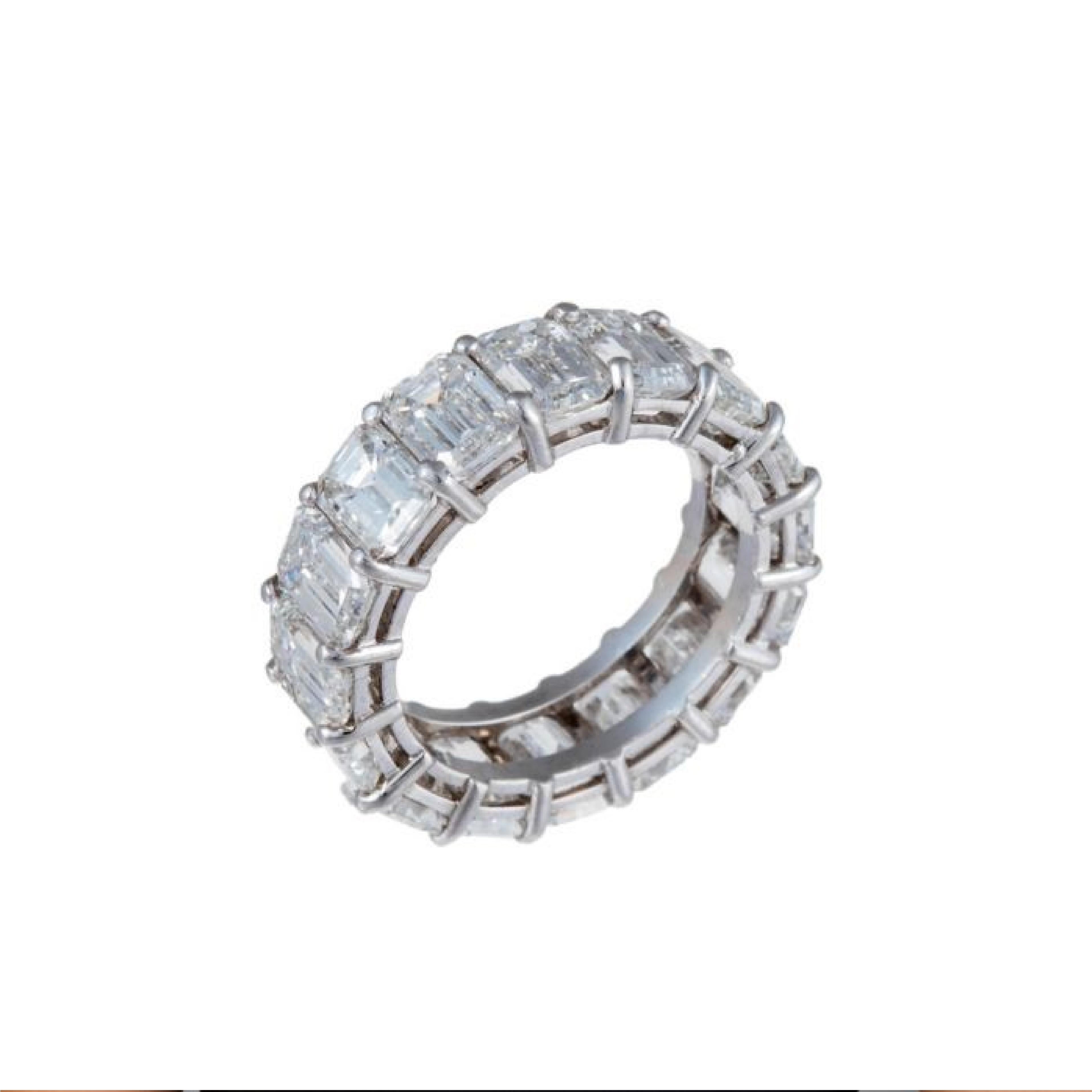 Platinum Emerald cut eternity diamond band with sixteen emerald cut diamonds. 
 
The diamond weight is 11.20 Carats, each stone approximately 0.70 carats. 

Ring size 6 1/2

Diamond specifications: 
F color, VVS-VS clarity

This product comes with a