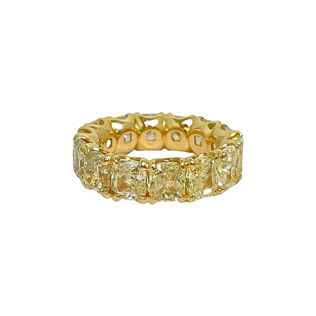 Yellow diamonds are the most popular of the fancy-colored diamond family. This dazzling 11.20 carat radiant cut Fancy Yellow diamond ring is set in 18k yellow gold to enhance the color of the stones. The setting, along with the radiant cut facets