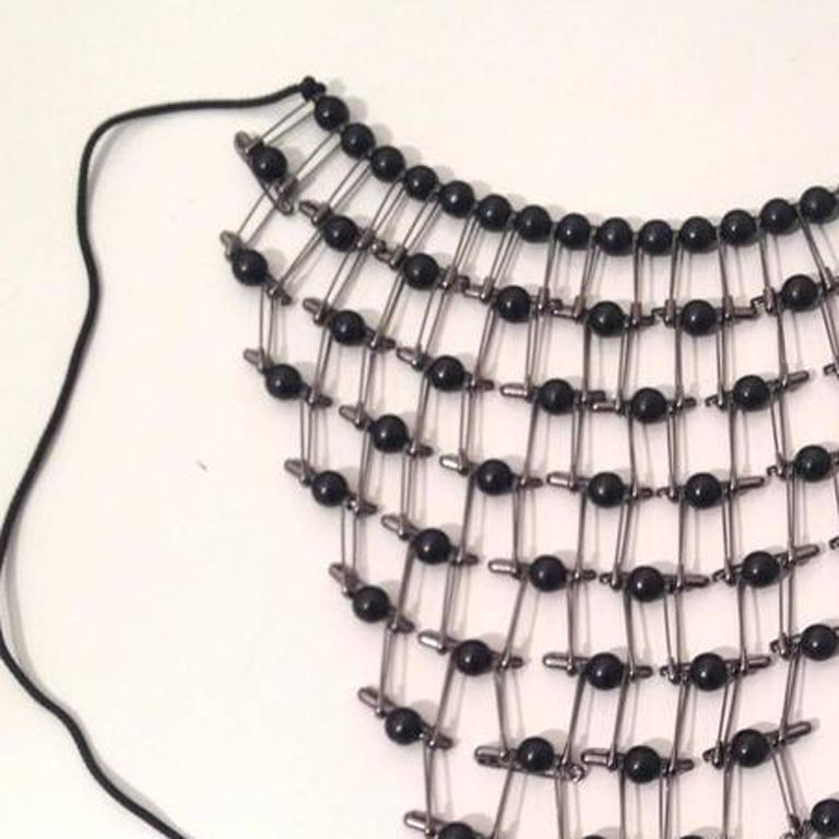 Tamiko Kawata, Lacy Bib Necklace, steel safety pin, wood bead, and cord, 1999 1