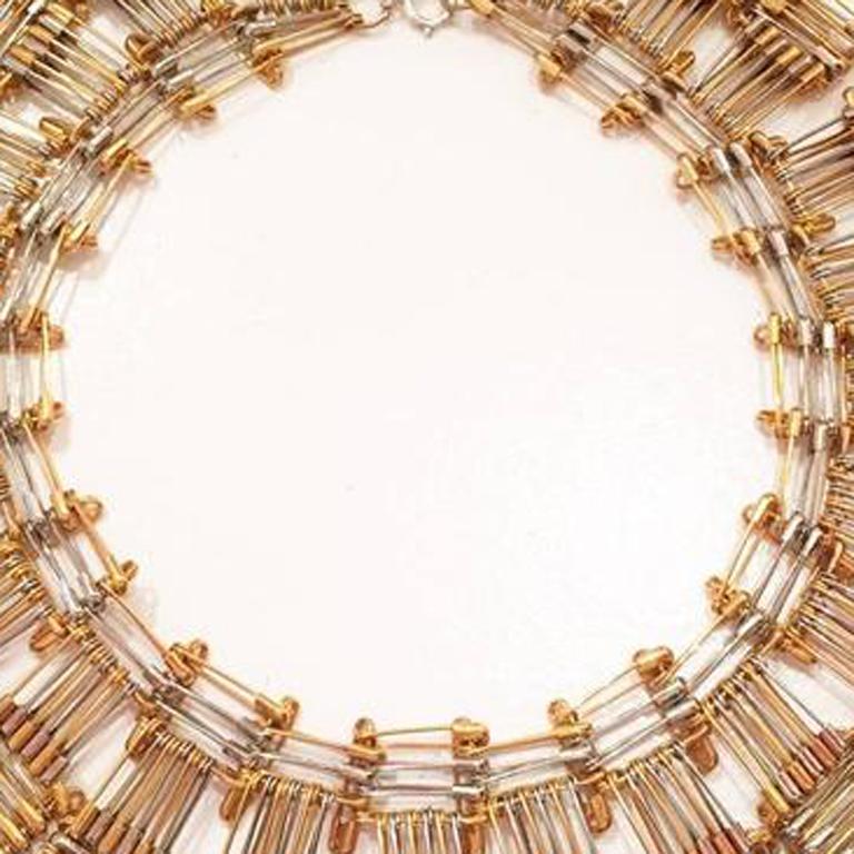 Tamiko Kawata repurposes quotidian objects and transforms them into wearable art necklaces. She likes to use overlooked indigenous objects from daily life for her medium. Discarded materials are important to her not only for environmental issues but