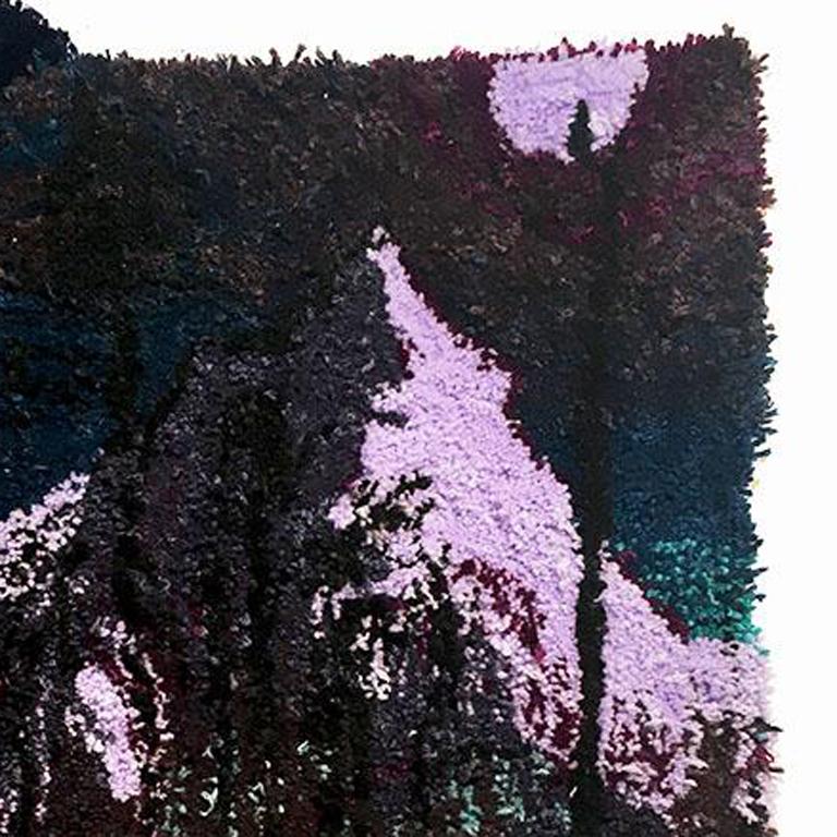 This is a hand crafted tapestry. It has a limited color palette of purple, green, blue and almost black. The tapestry portrays two wolves running through a forest or field at night to go on a hunt. The wolves are all but in shadow. The purple moon