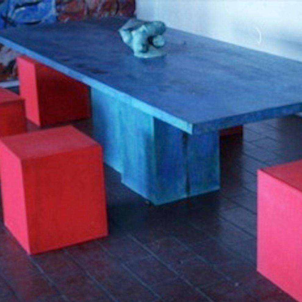 INDOOR OUTDOOR TABLE ART BLUE WITH RED CHAIRS STEEL DYE MODERN TABLE Sculptor and artist Nathan Slate Joseph is renowned for his unique process of creating dynamic, abstract compositions of galvanized steel. The Israeli-born artist produces