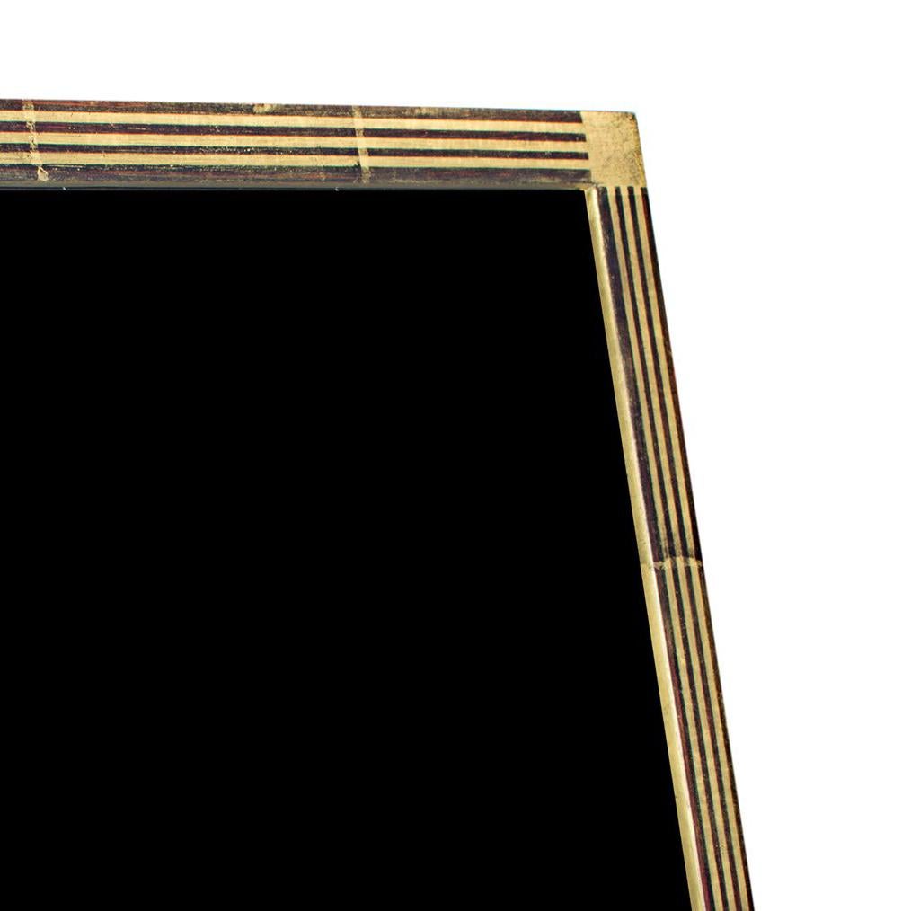 This photo frame was hand-made in Romania and features 22K gold leafing. It is made out of wood and includes archival plexiglass to protect anything displayed in it from fading or other damage from light. This frame can be used both vertically and