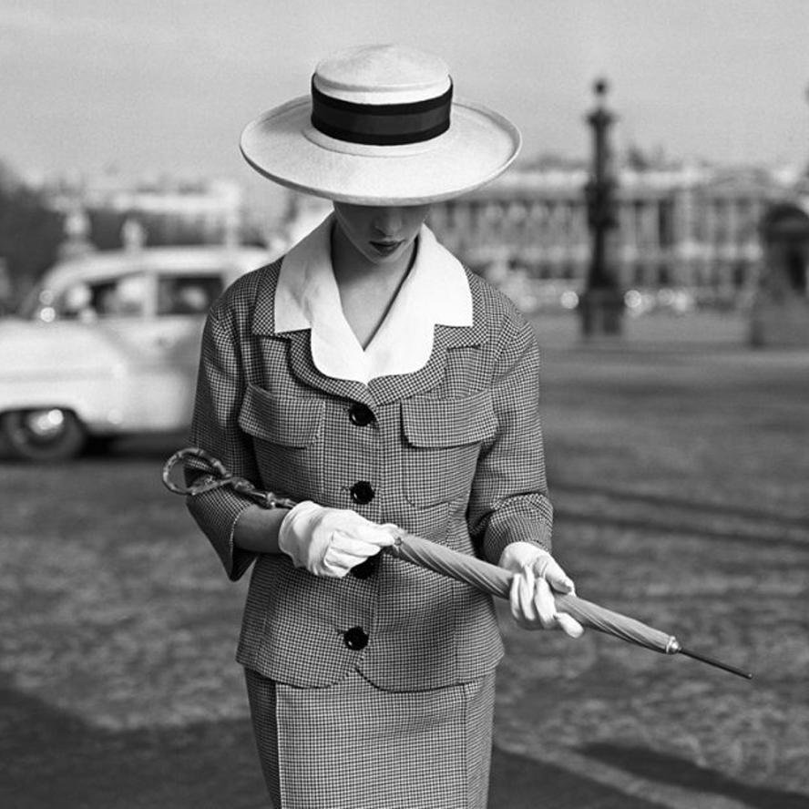 Girl umbrella Concorde Place  - Photograph by Georges Dambier