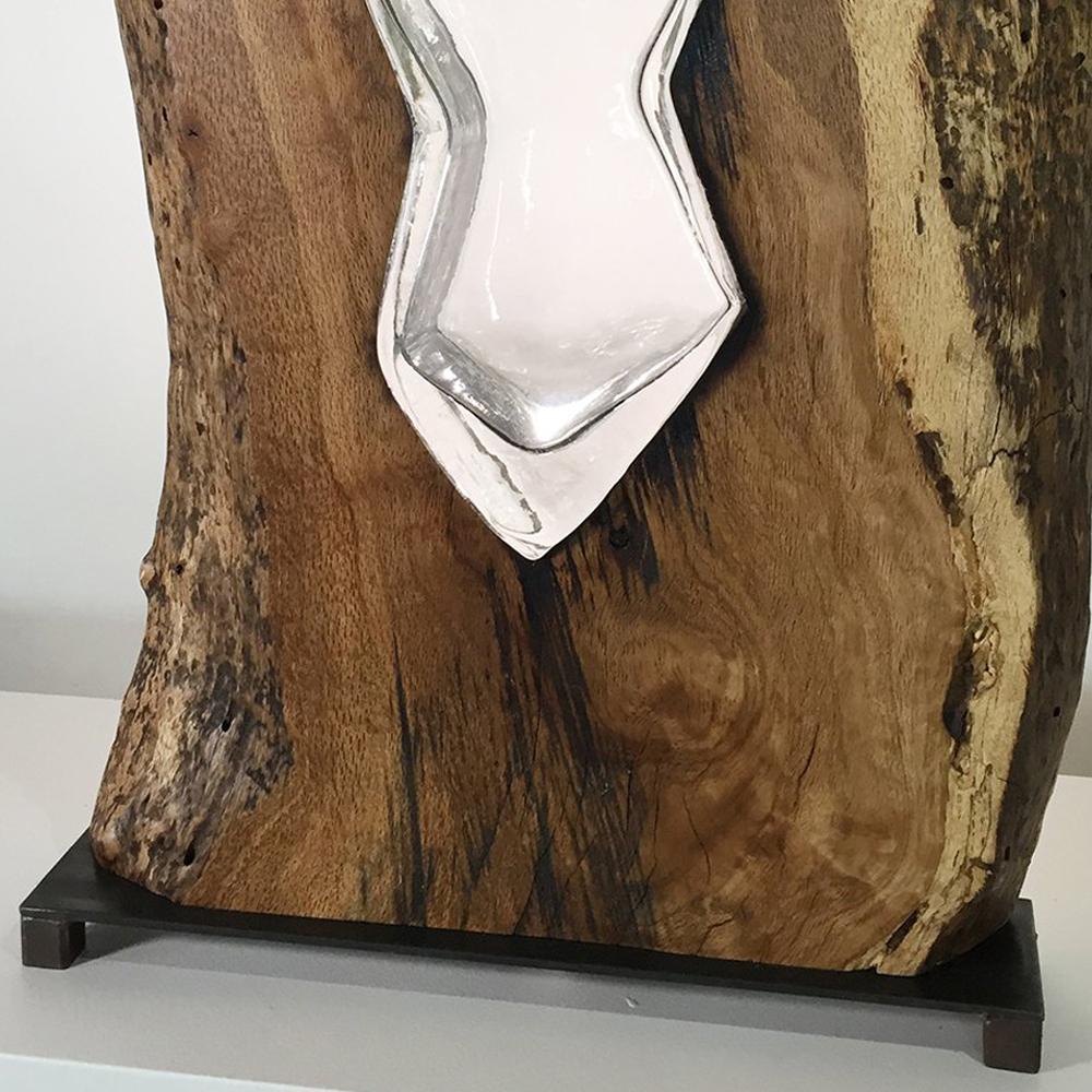 Live Edge California Oak Wood with Hand Blown Glass.
The Glass is Blown Directly into the Wood 
This is a Functional Sculpture and can be used for Flowers.
Perfect Accent Piece for any Room.
Designed by Scott Slagerman in Collaboration with Jim