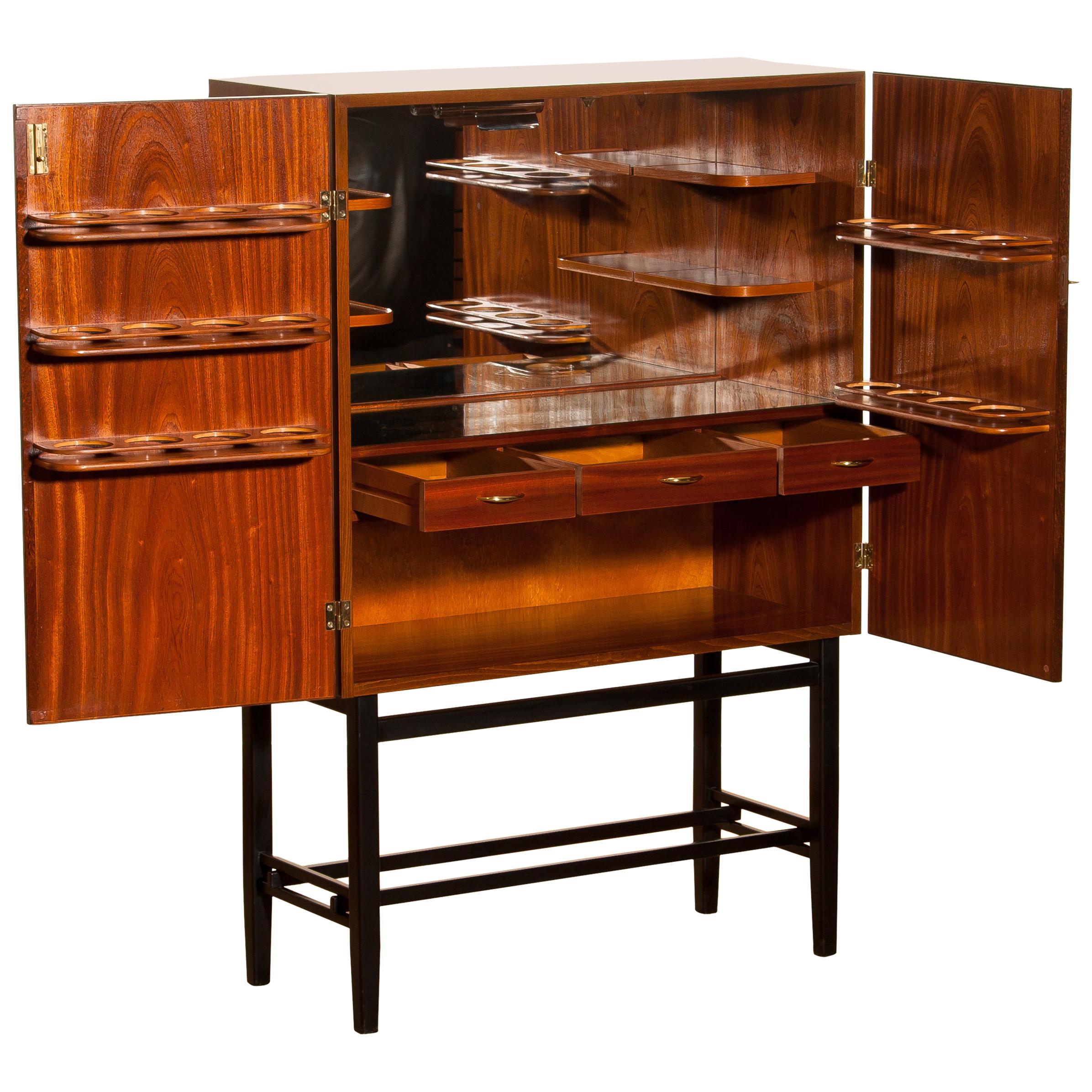 1968, Mahogany and Brass Dry Bar Cabinet High Black Skinny Legs by Förenade
