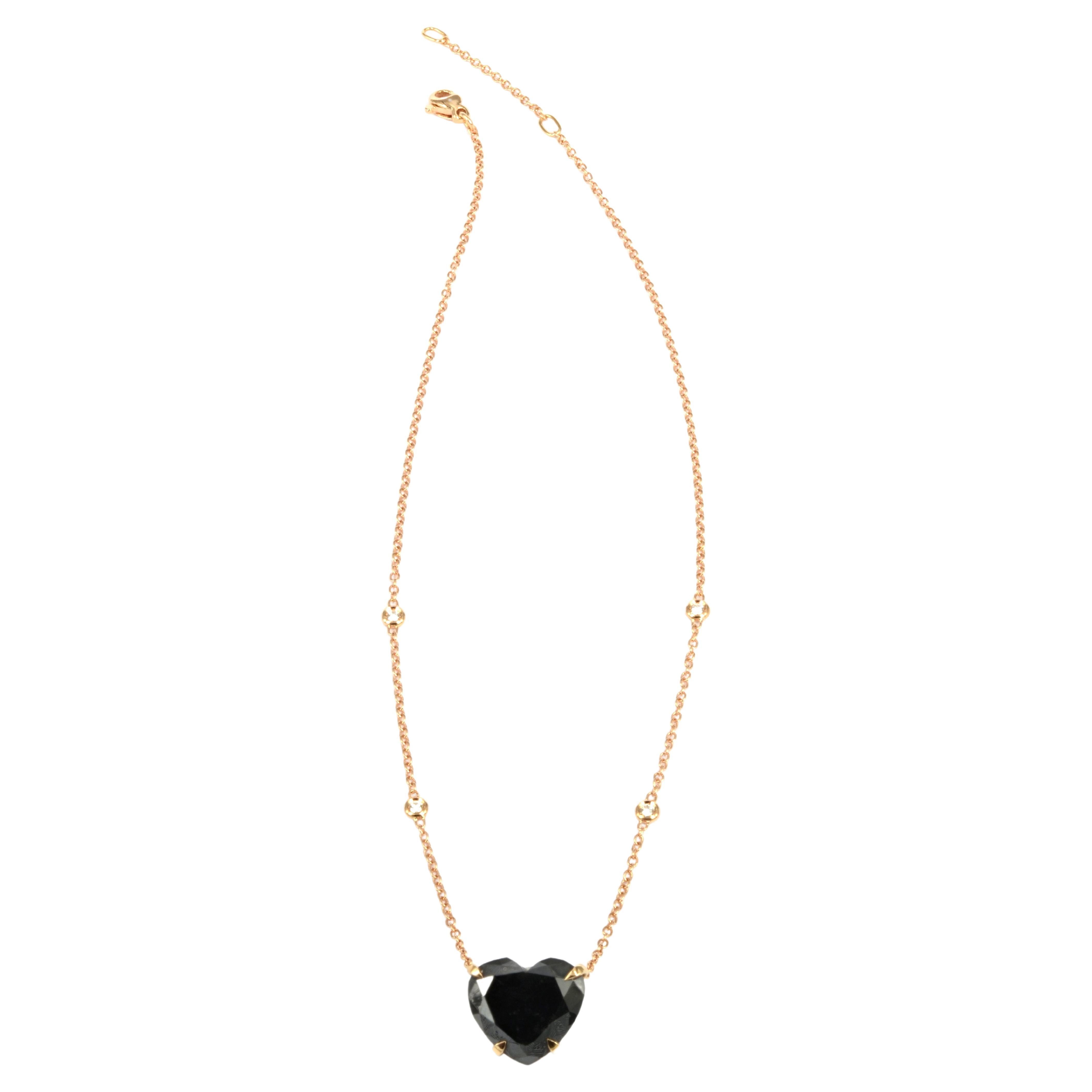 Enchanting heart cut black diamond weighing 11.22 carats mounted in 18 Kt rose gold, on a rose gold chain featuring 
4 spectacol set white round diamonds. A special gift for love!
Unique, different, rock, yest classic and forever chic.
We suggest to